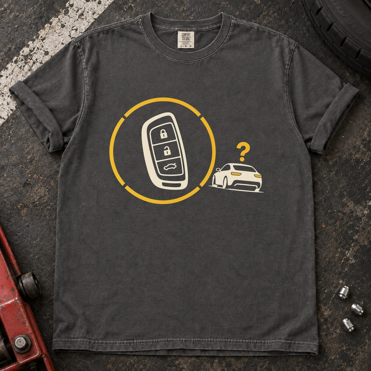 Pepper T-shirt with a key fob inside a circular signal graphic beside a small car and question mark.