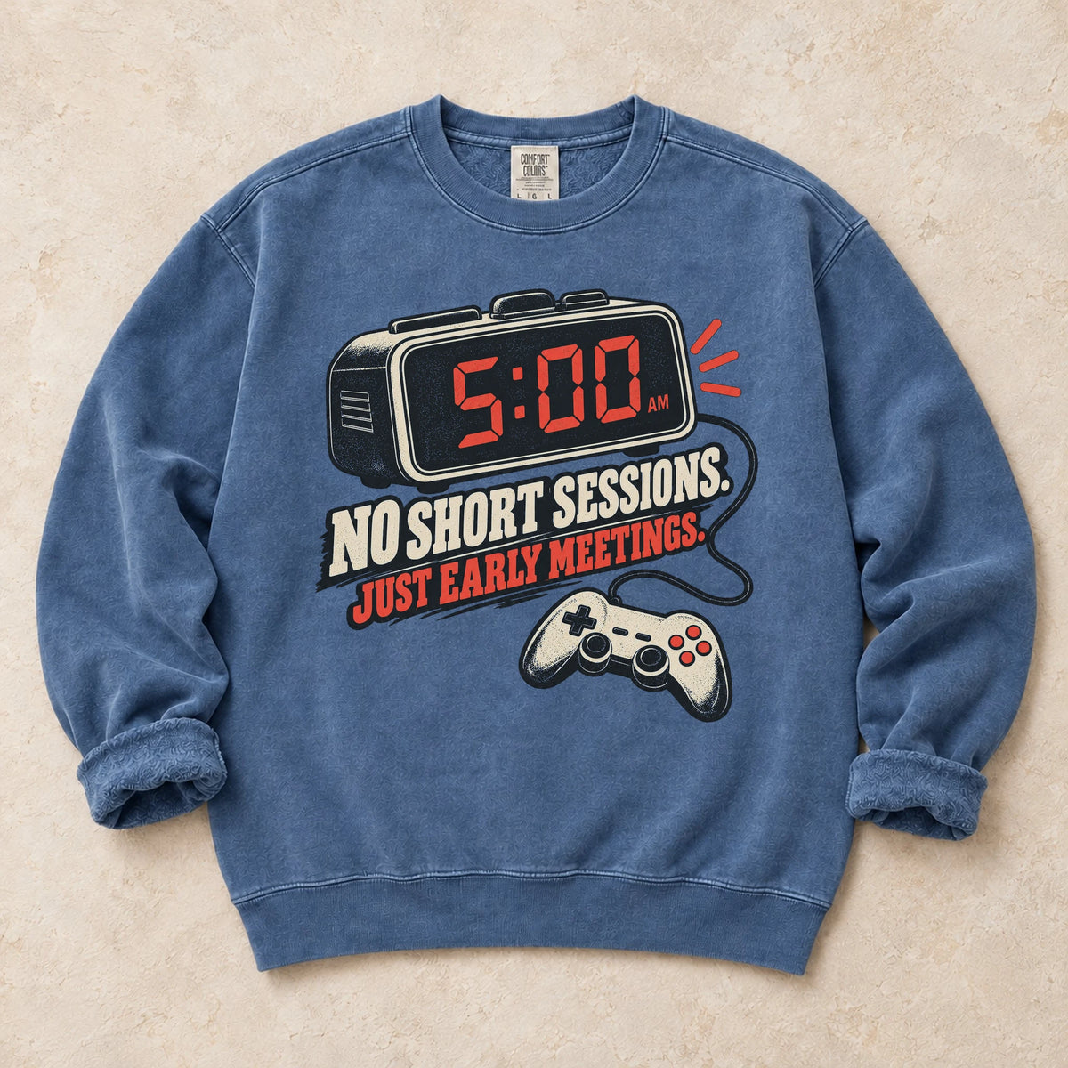 Blue Jean gaming sweatshirt. An early alarm and controller show there are no short sessions, just early meetings.