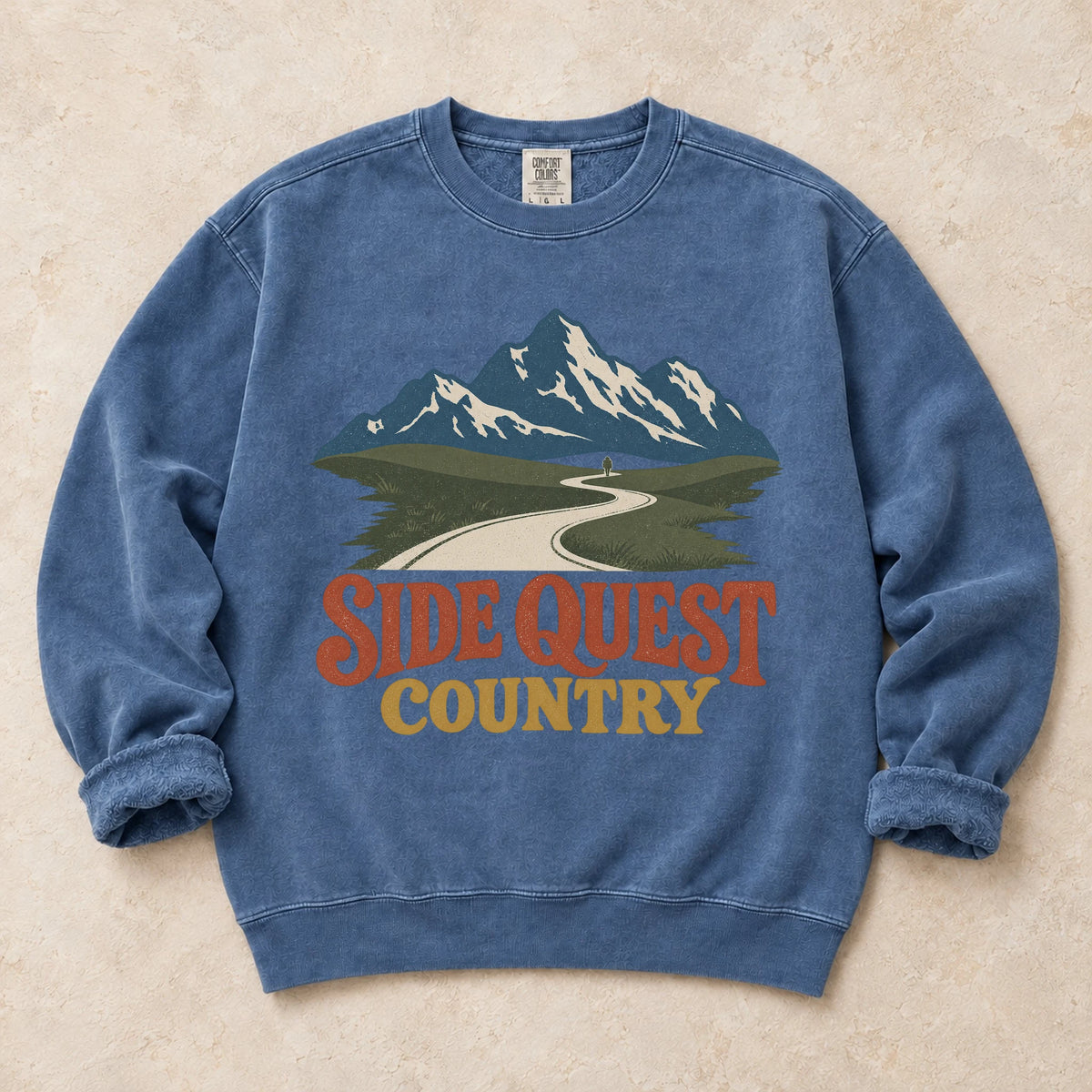 Blue Jean gaming sweatshirt. A winding mountain path welcomes explorers to side quest country.