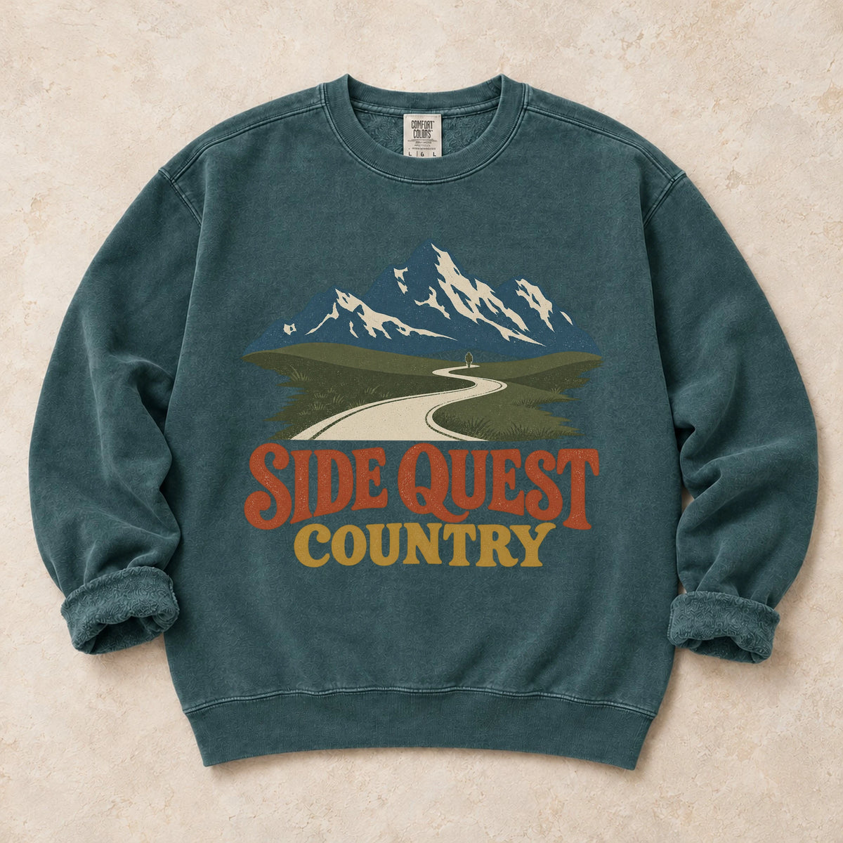 Blue Spruce gaming sweatshirt. A winding mountain path welcomes explorers to side quest country.