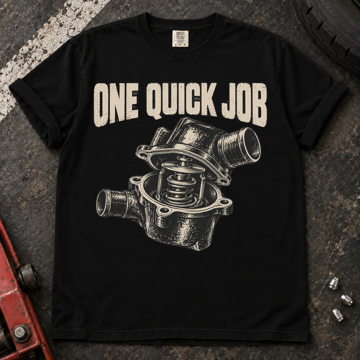 Black car enthusiast T-shirt. An opened thermostat assembly questions the promise of one quick job.