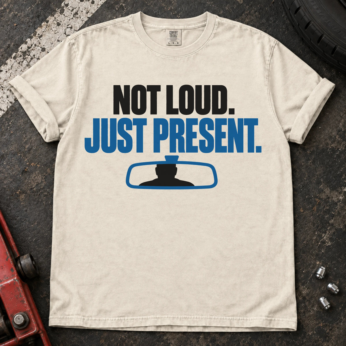 Ivory car enthusiast T-shirt. A rearview mirror backs not loud, just present.