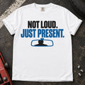 White car enthusiast T-shirt. A rearview mirror backs not loud, just present.