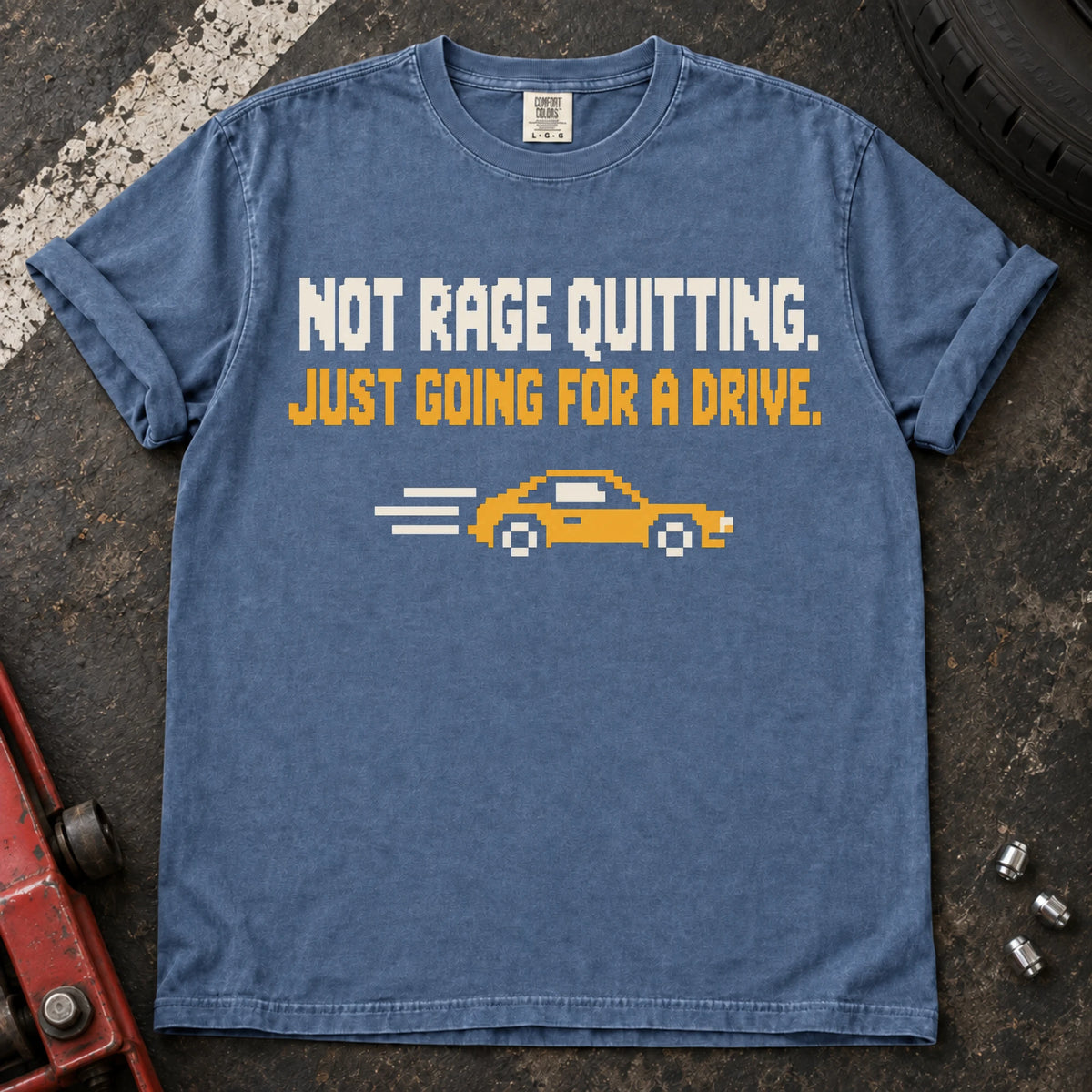 Blue Jean car enthusiast T-shirt. A pixel car drives away: not rage quitting, just going for a drive.