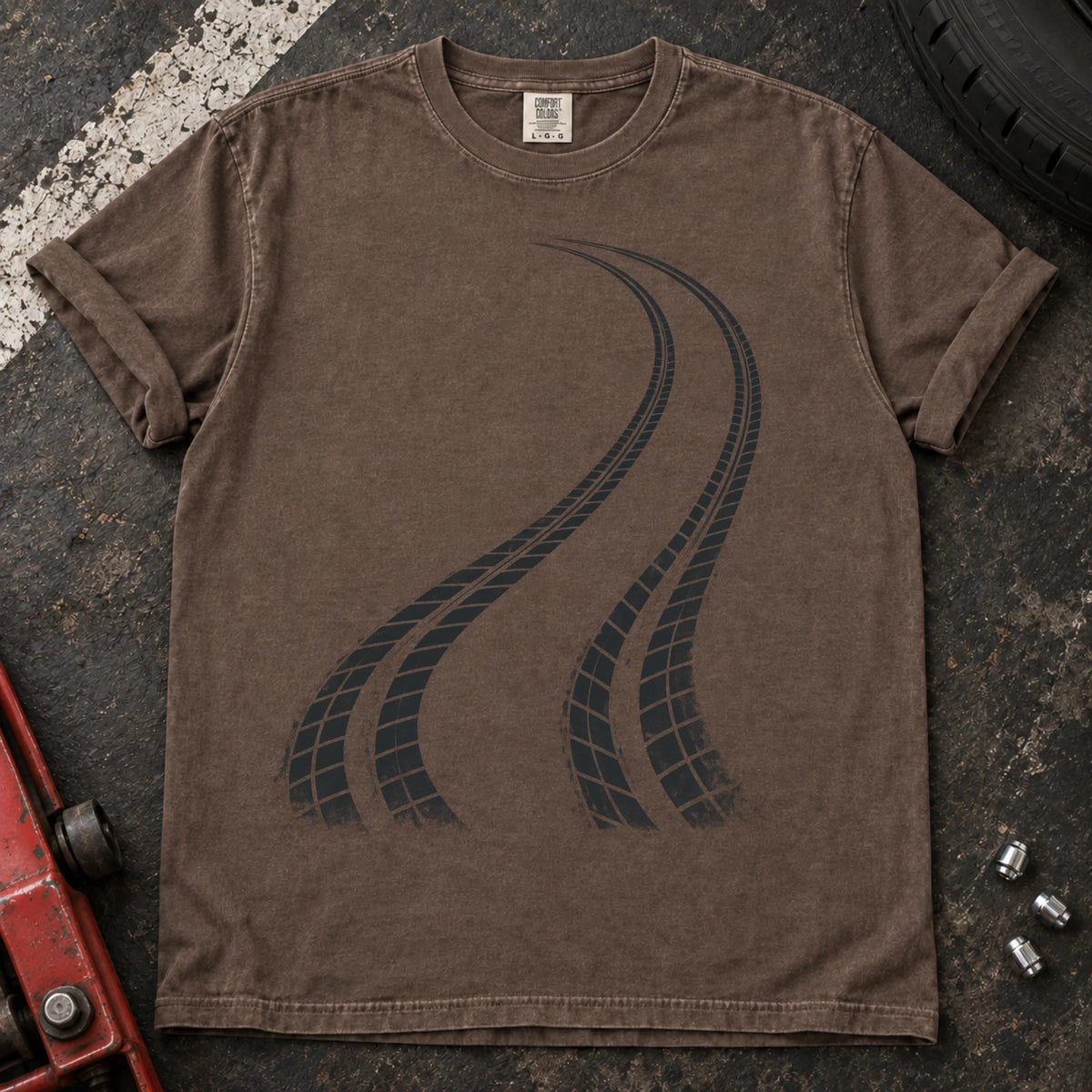 Espresso car enthusiast T-shirt. Two curving tire tracks capture a minimalist rear-bias driving graphic.