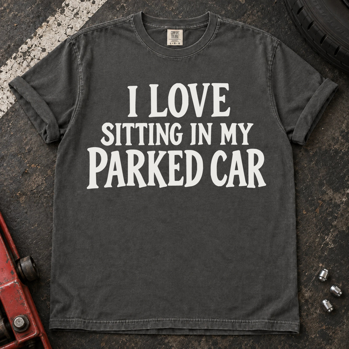 Pepper T-shirt with serif lettering reading 'I love sitting in my parked car'.