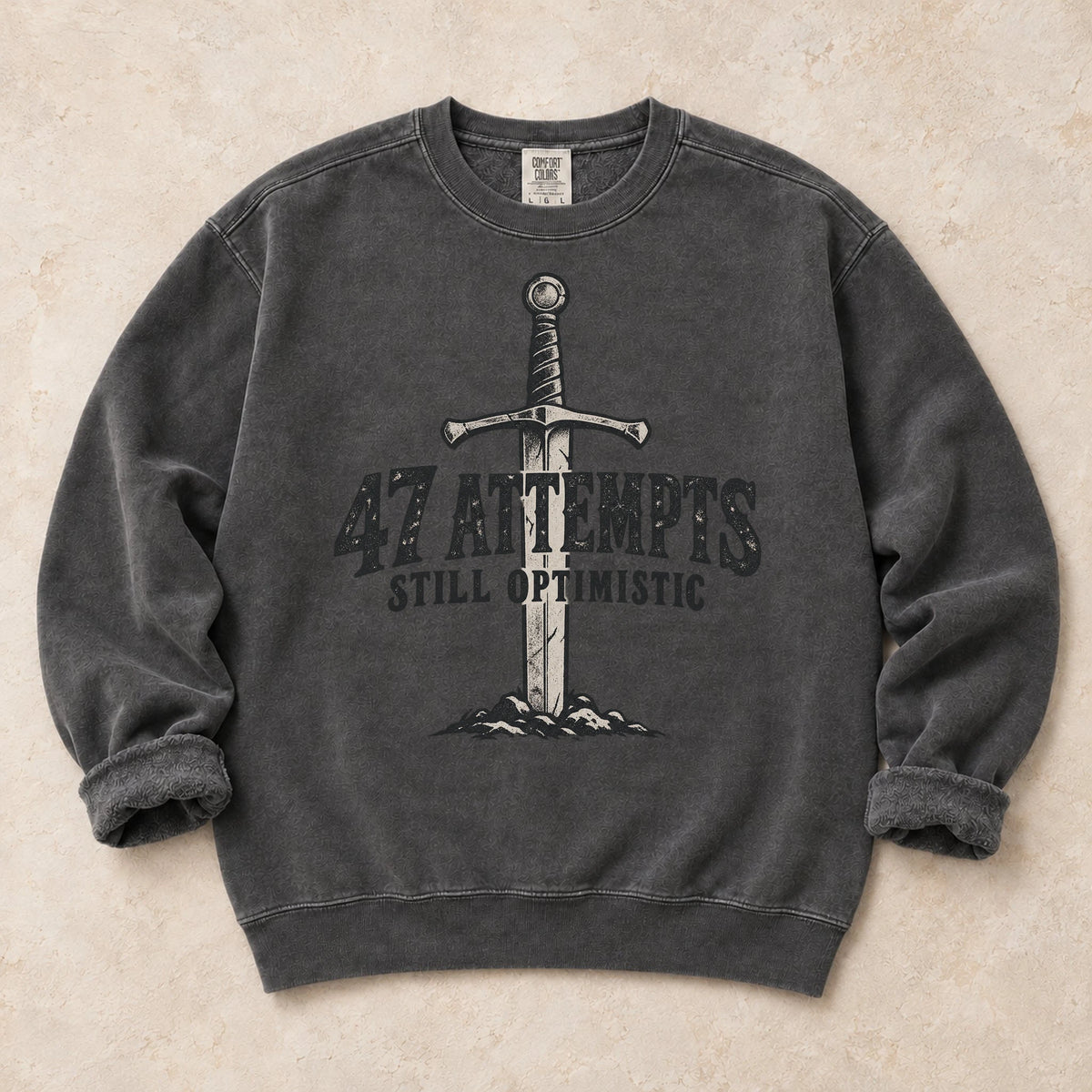 Pepper gaming sweatshirt. A planted sword celebrates 47 attempts and still optimistic.