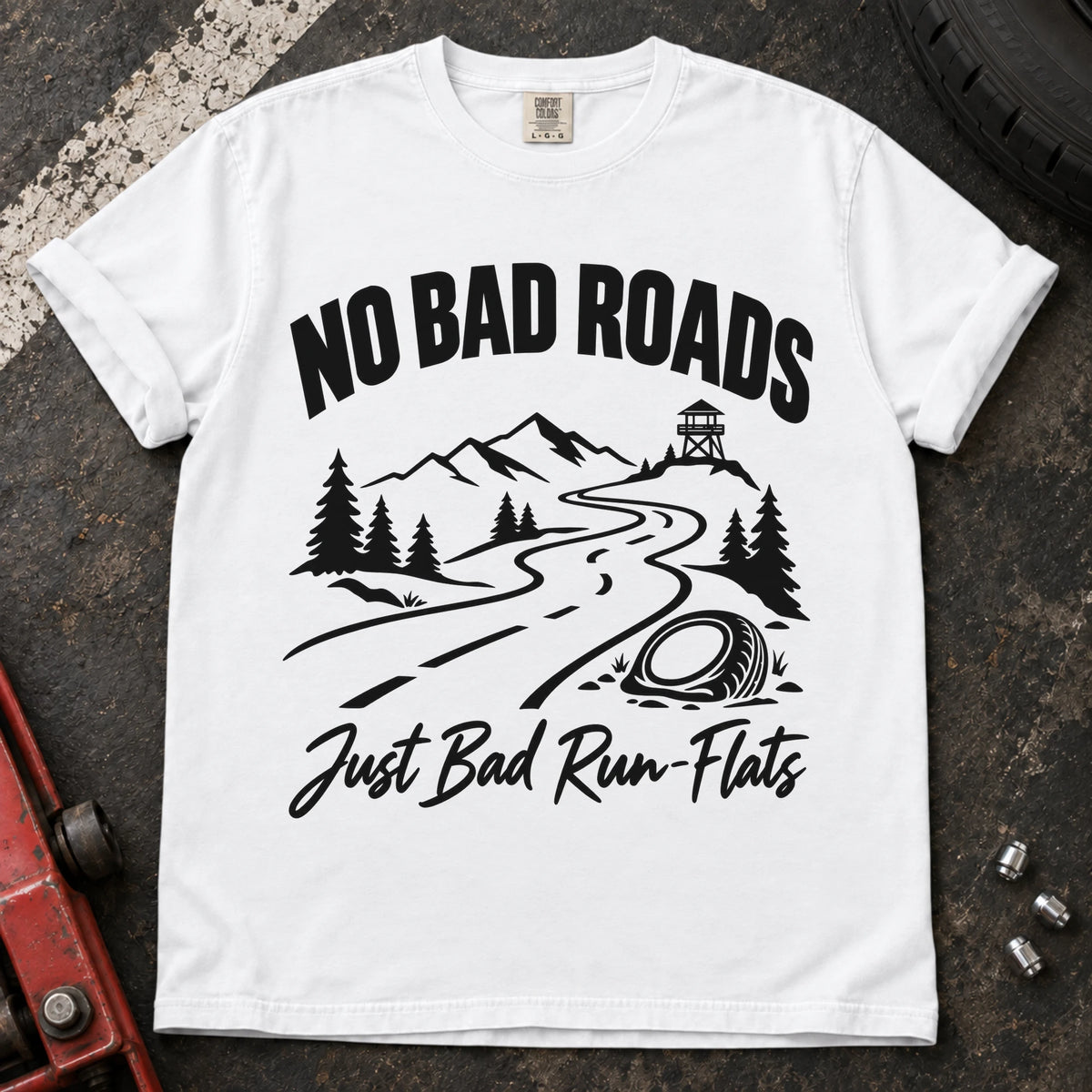 White car enthusiast T-shirt. A mountain road and failed tire explain no bad roads, just bad run-flats.