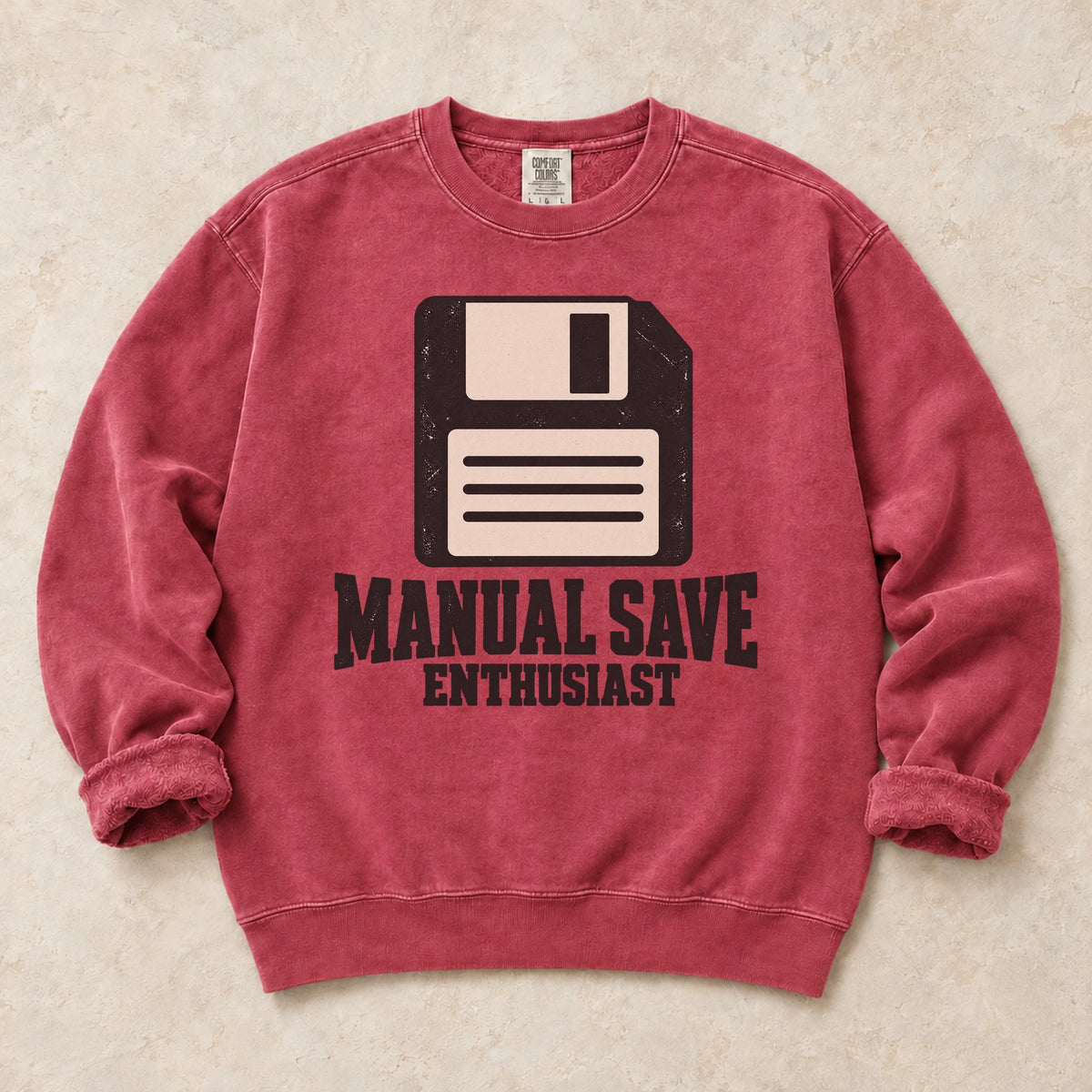Crimson gaming sweatshirt. A floppy disk celebrates the manual save enthusiast.