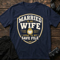 Navy gaming T-shirt. A shield crest pledges marriage to a wife and loyalty to a save file.