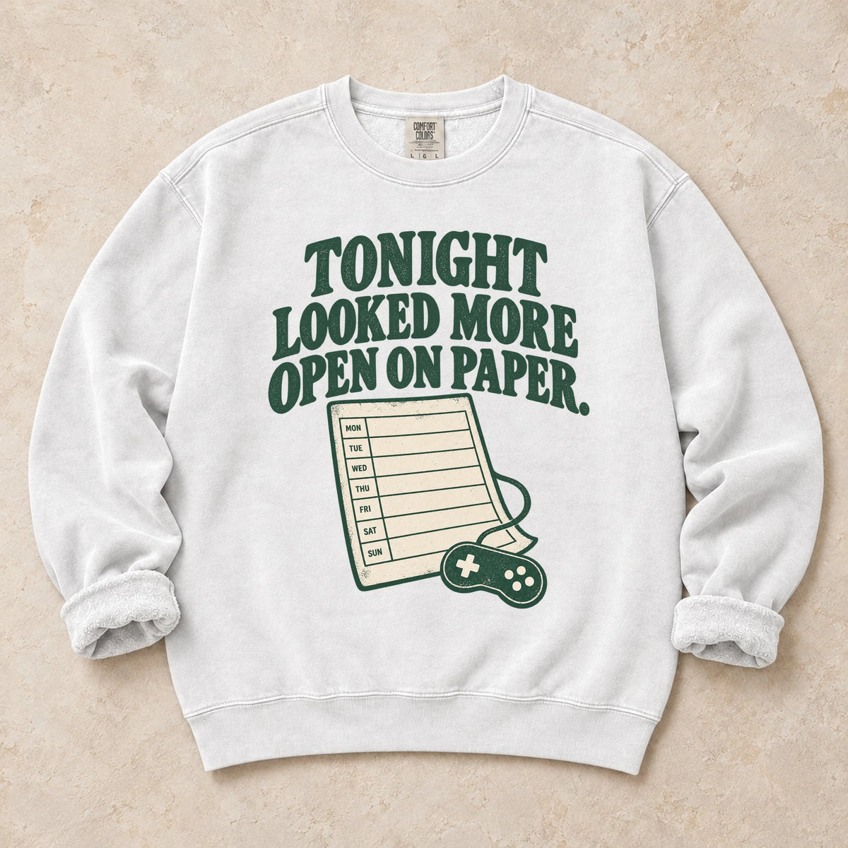 White gaming sweatshirt. A calendar and controller reveal tonight looked more open on paper.