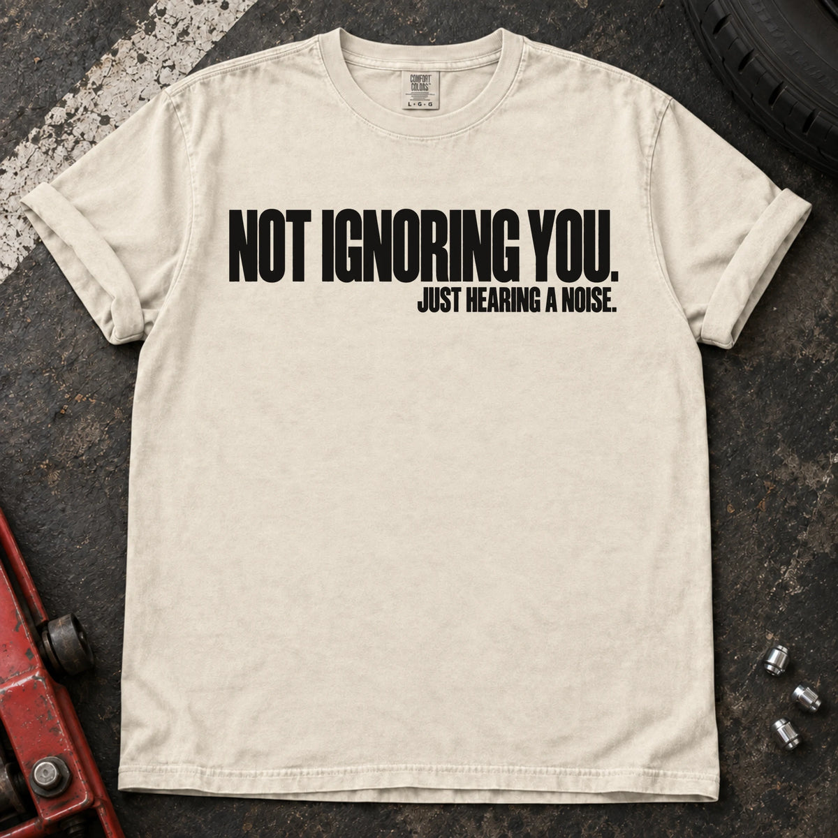 Ivory car enthusiast T-shirt. Not ignoring you, just hearing a noise: understated car-owner typography.