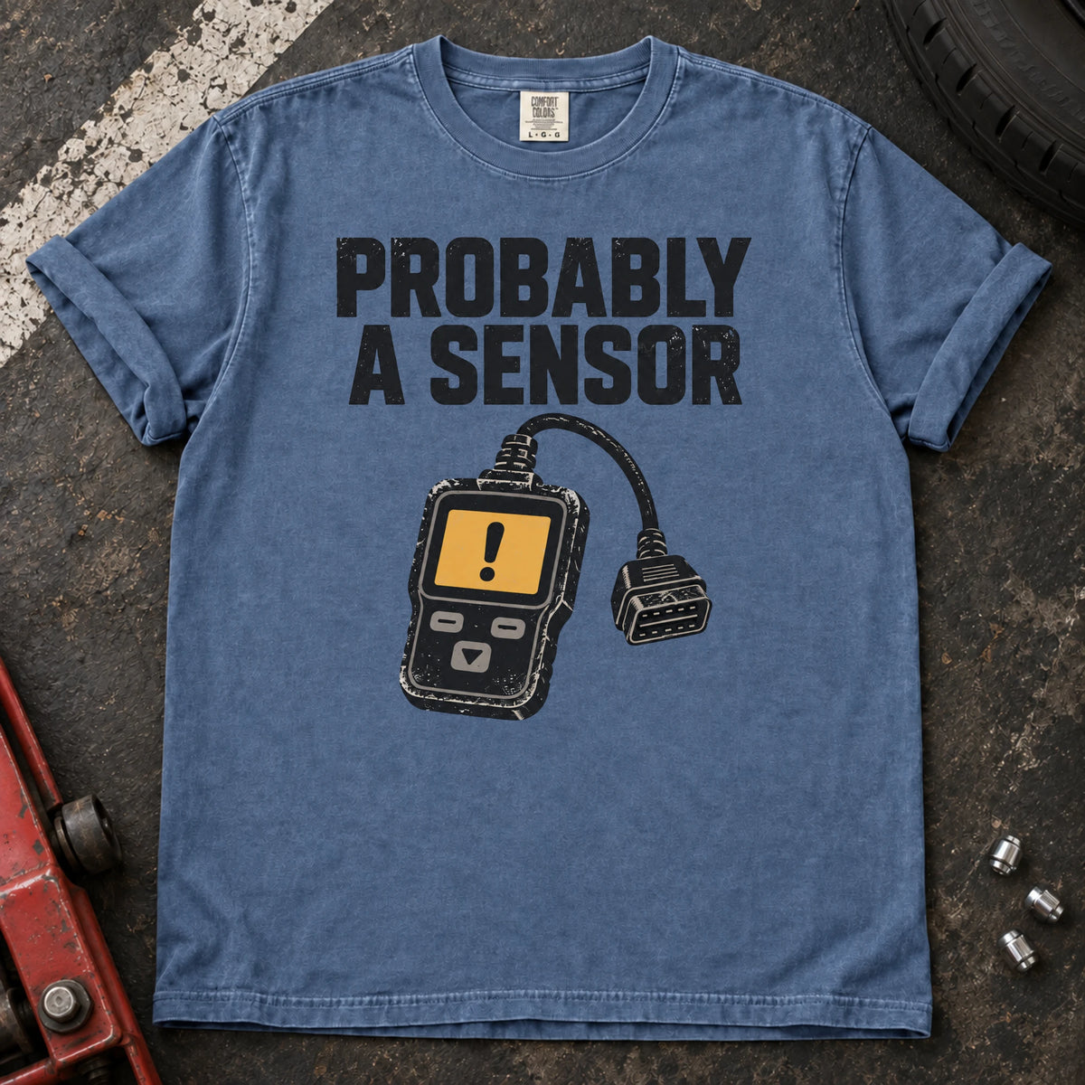 Blue Jean car enthusiast T-shirt. A diagnostic scanner backs the hopeful diagnosis, probably a sensor.