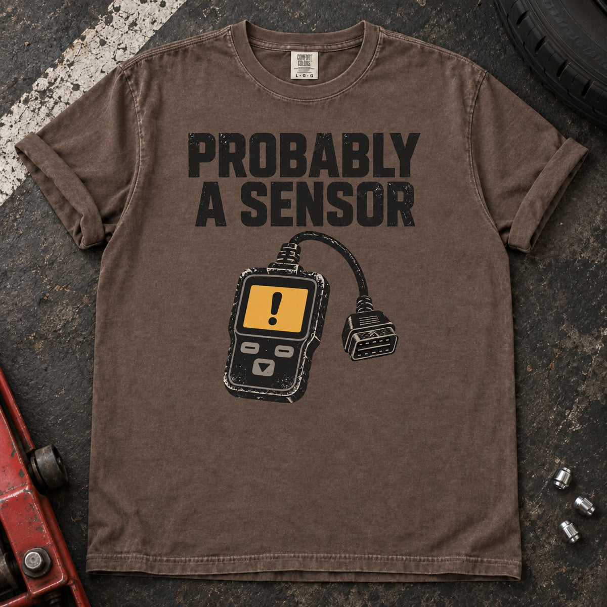 Espresso car enthusiast T-shirt. A diagnostic scanner backs the hopeful diagnosis, probably a sensor.