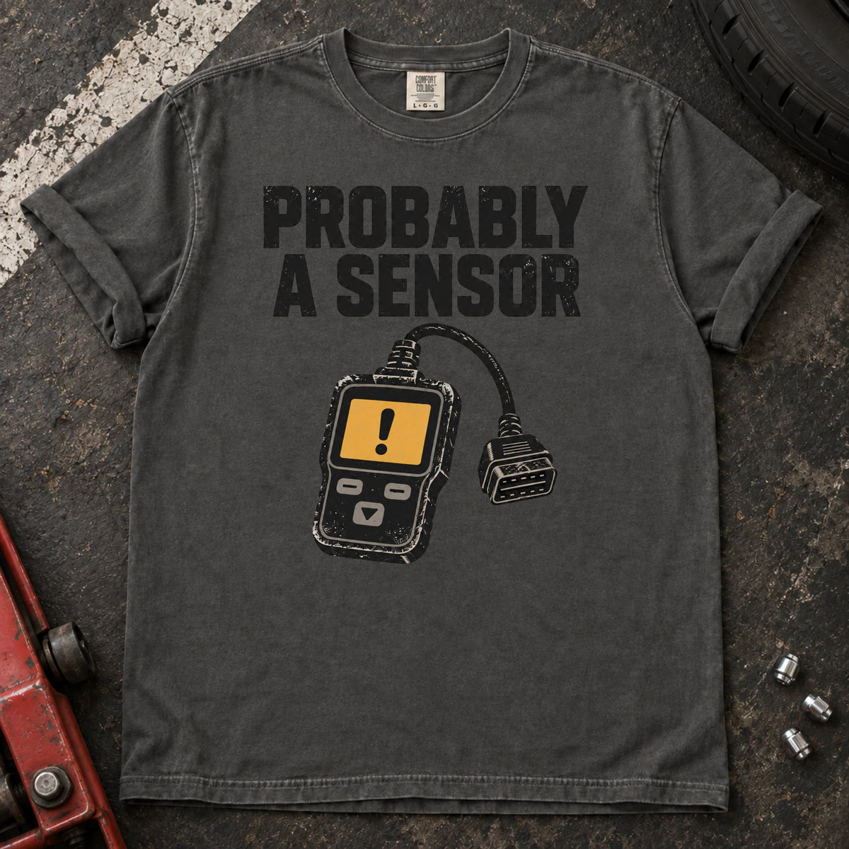 Pepper car enthusiast T-shirt. A diagnostic scanner backs the hopeful diagnosis, probably a sensor.