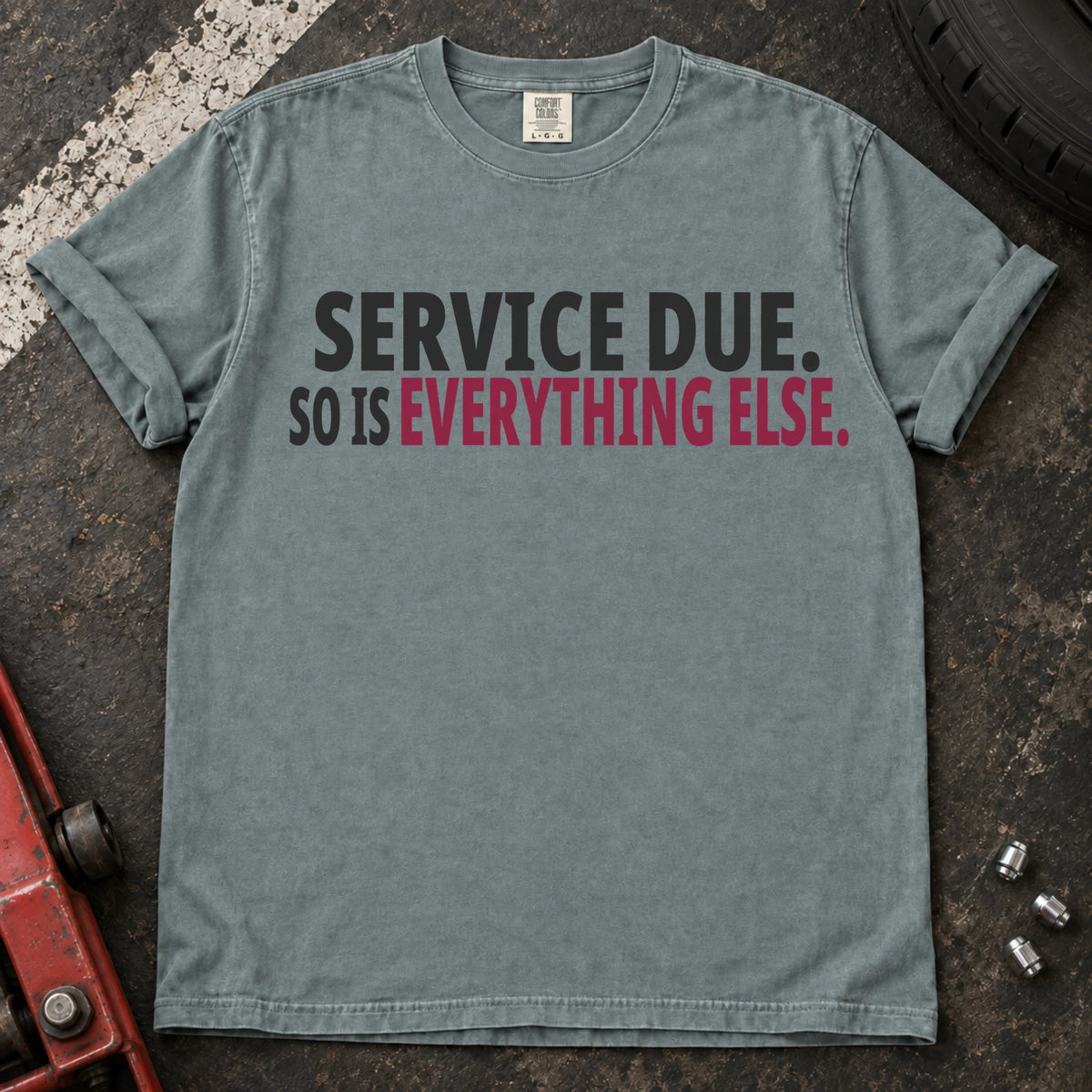 Bay T-shirt with bold black lettering reading 'Service due. So is everything else'.