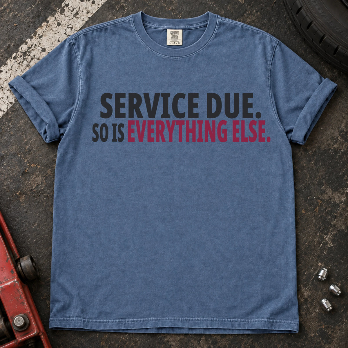 Blue Jean T-shirt with bold black lettering reading 'Service due. So is everything else'.