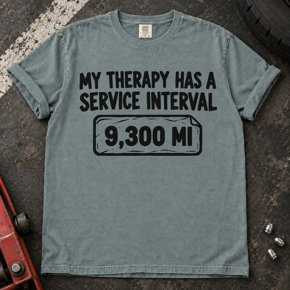 Bay T-shirt reading 'My therapy has a service interval' above a mileage service reminder.