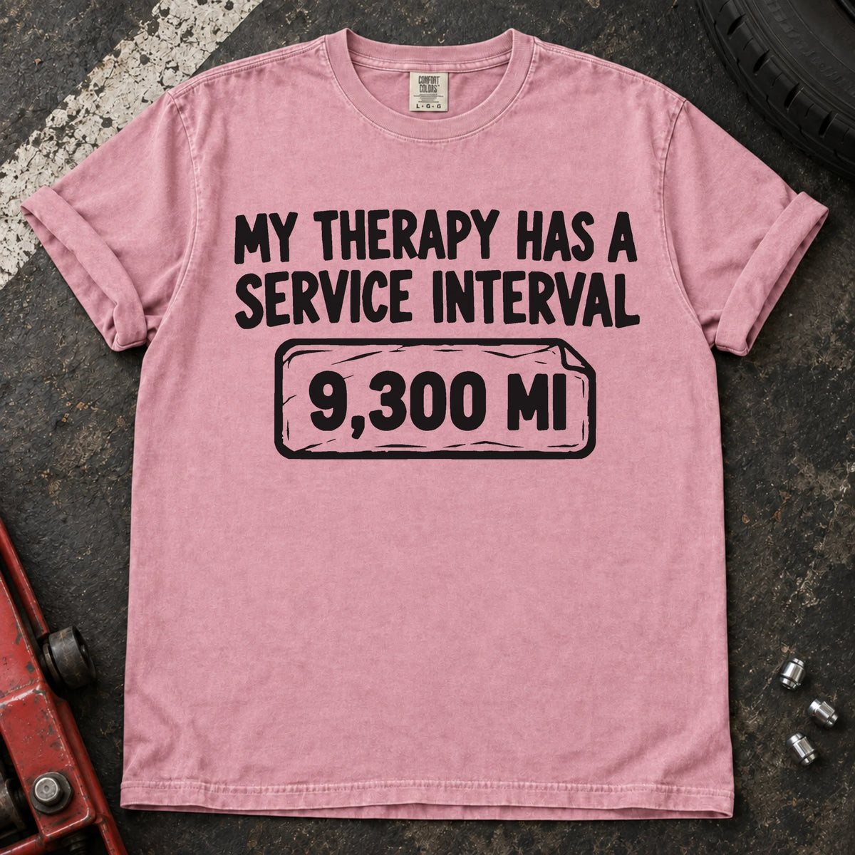 Blossom T-shirt reading 'My therapy has a service interval' above a mileage service reminder.