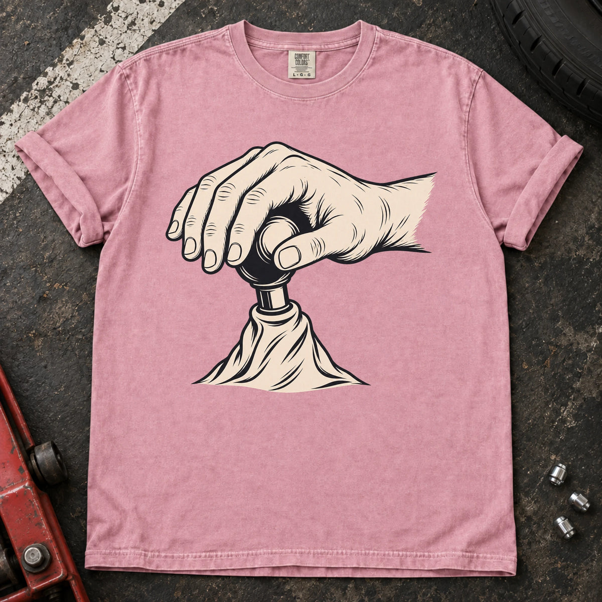 Blossom car enthusiast T-shirt. A hand on a gear lever celebrates the small ritual of manual shifting.