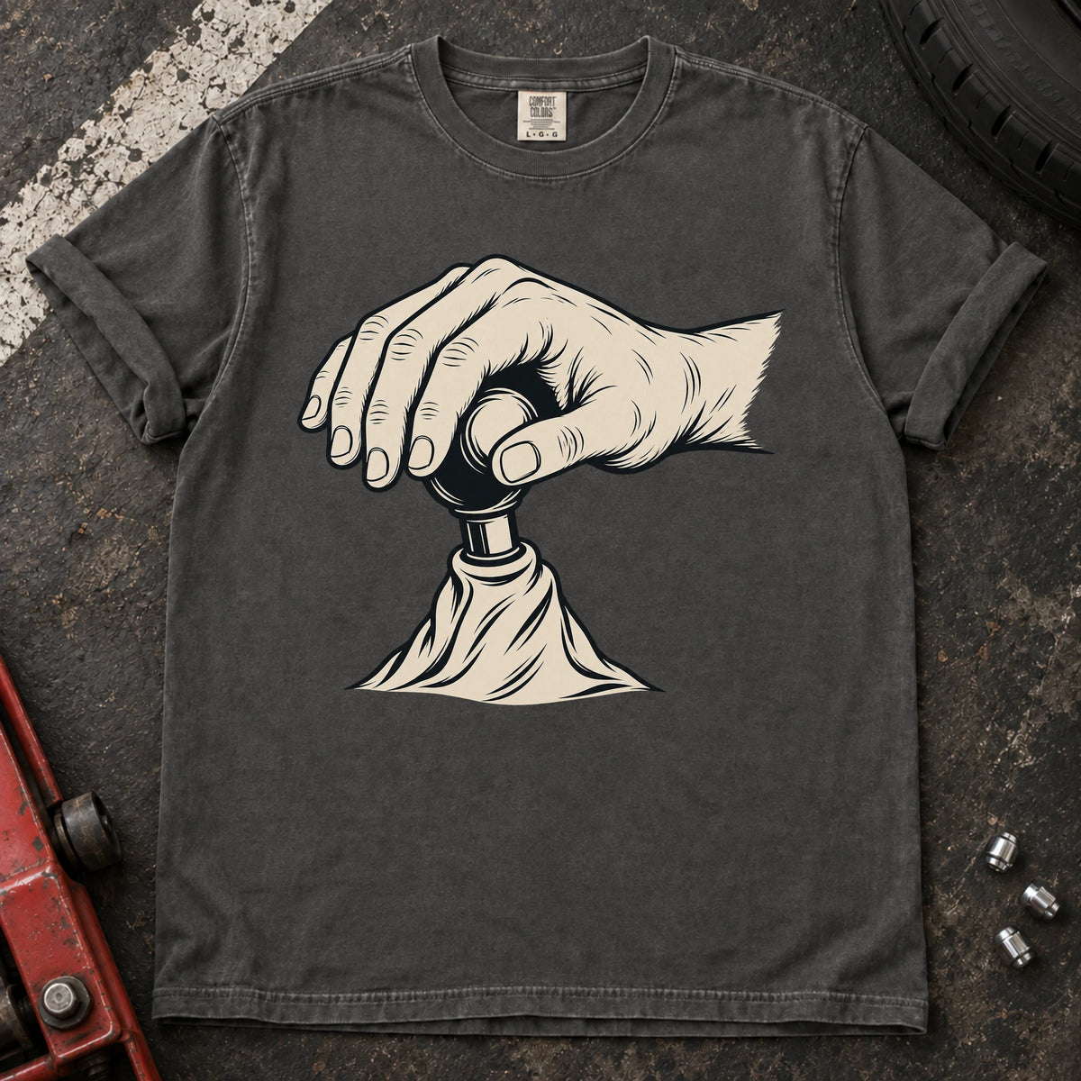 Pepper car enthusiast T-shirt. A hand on a gear lever celebrates the small ritual of manual shifting.