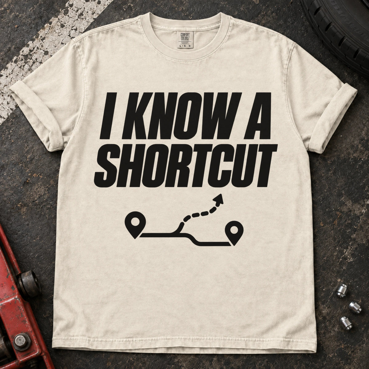 Ivory car enthusiast T-shirt. A branching route follows the confident claim, I know a shortcut.