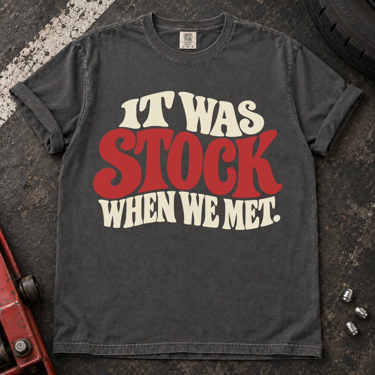 Pepper T-shirt with cream and red vintage lettering reading 'It was stock when we met'.