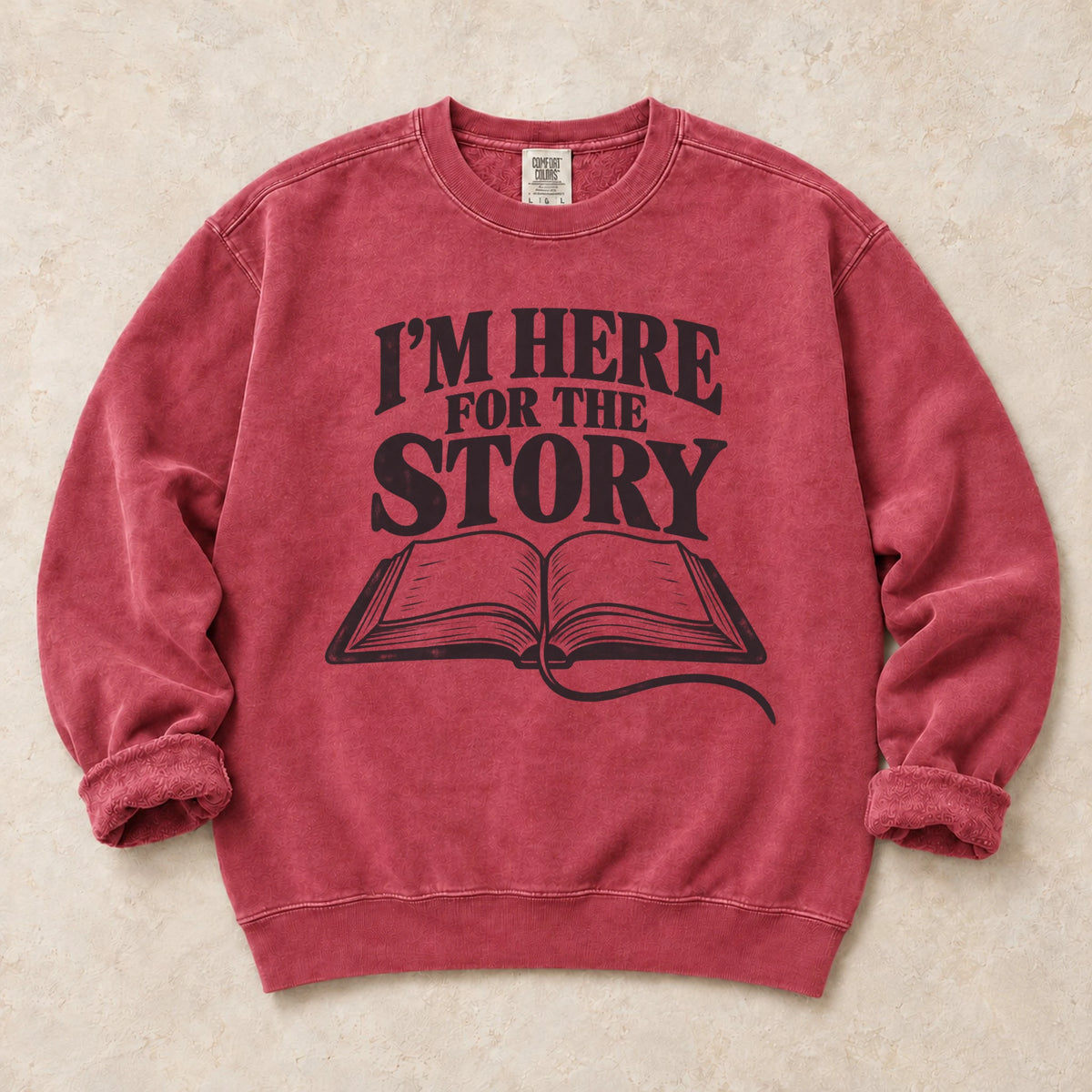 Crimson gaming sweatshirt. An open book declares I'm here for the story.