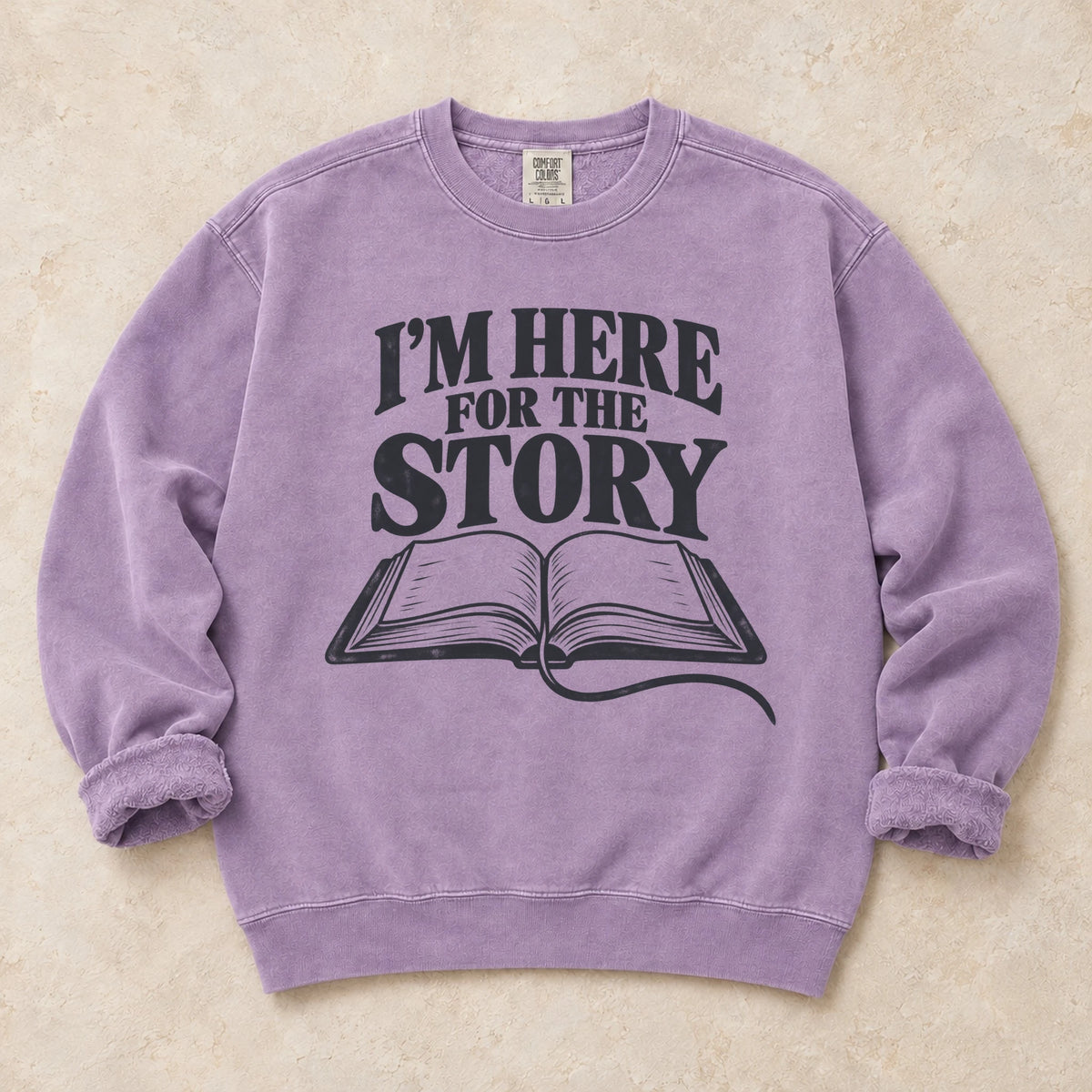 Orchid gaming sweatshirt. An open book declares I'm here for the story.