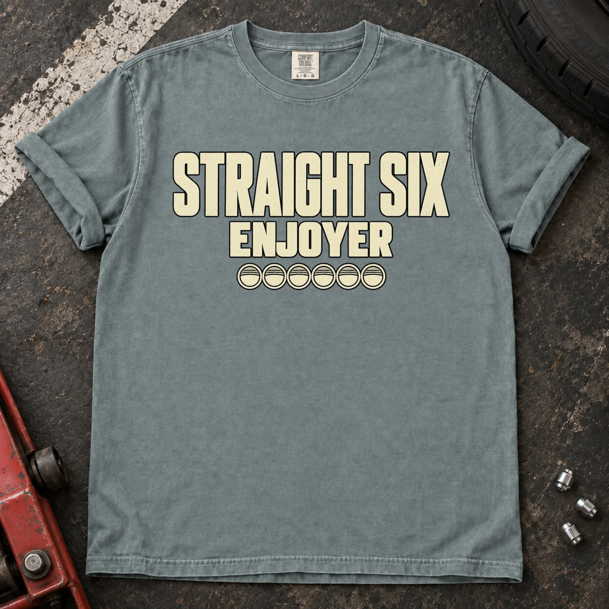 Bay car enthusiast T-shirt. Six small cylinder symbols accompany Straight Six Enjoyer lettering.