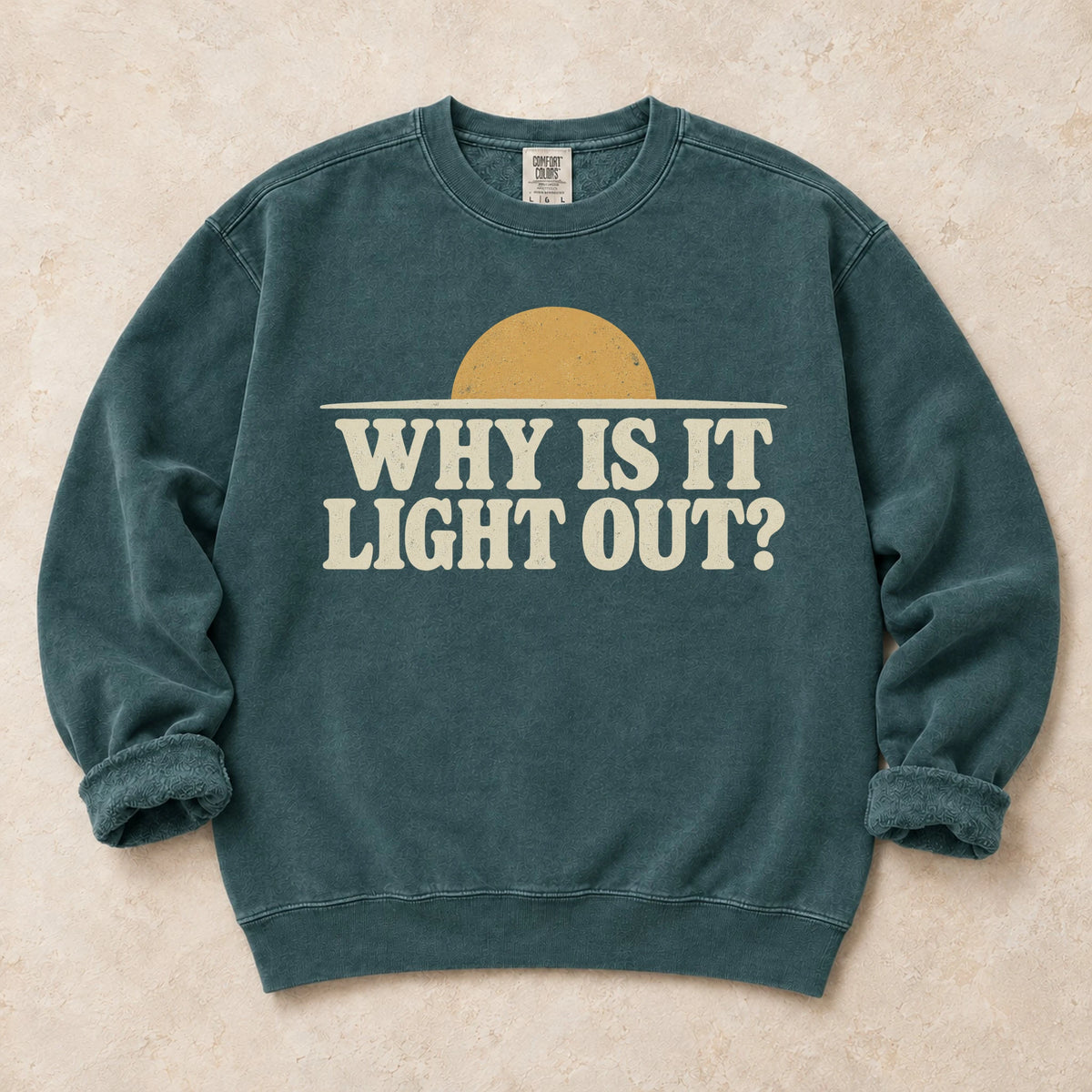Blue Spruce gaming sweatshirt. A sun above the horizon asks the late-night player, why is it light out?