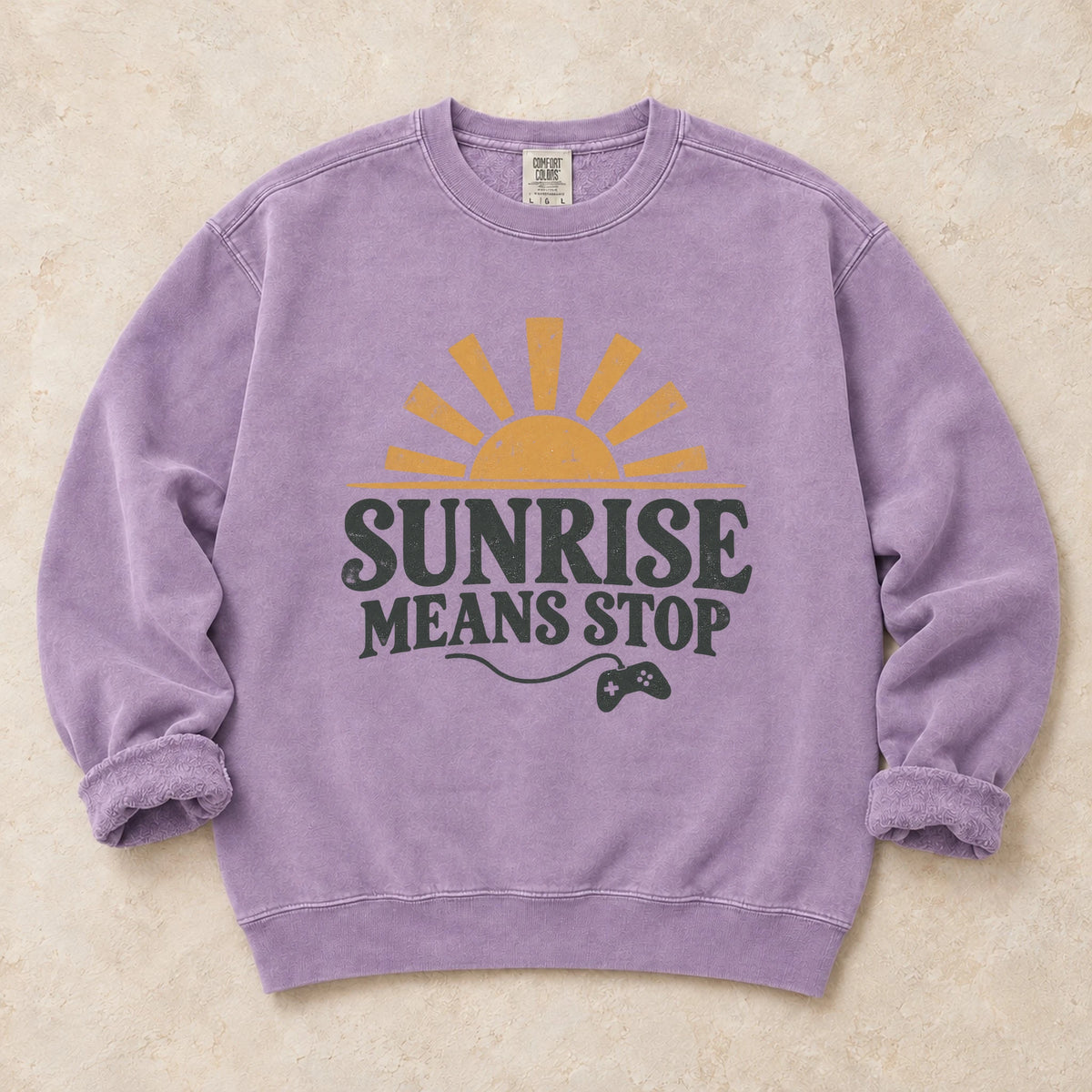 Orchid gaming sweatshirt. A rising sun and controller remind night gamers that sunrise means stop.