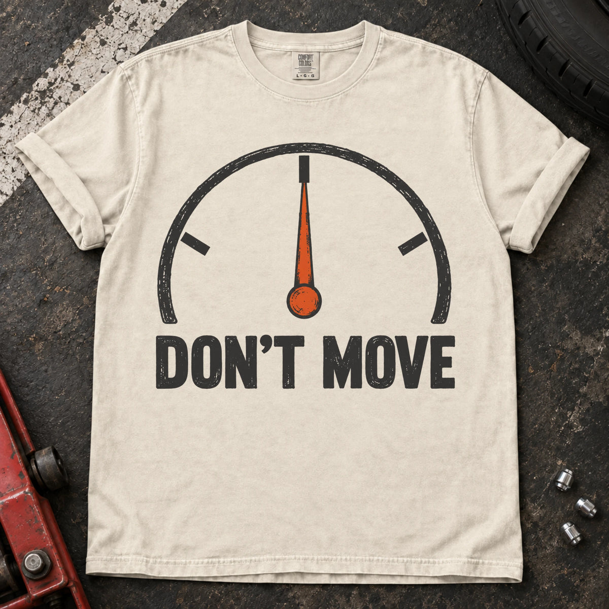 Ivory car enthusiast T-shirt. A temperature gauge stays centered under the hopeful instruction, don't move.