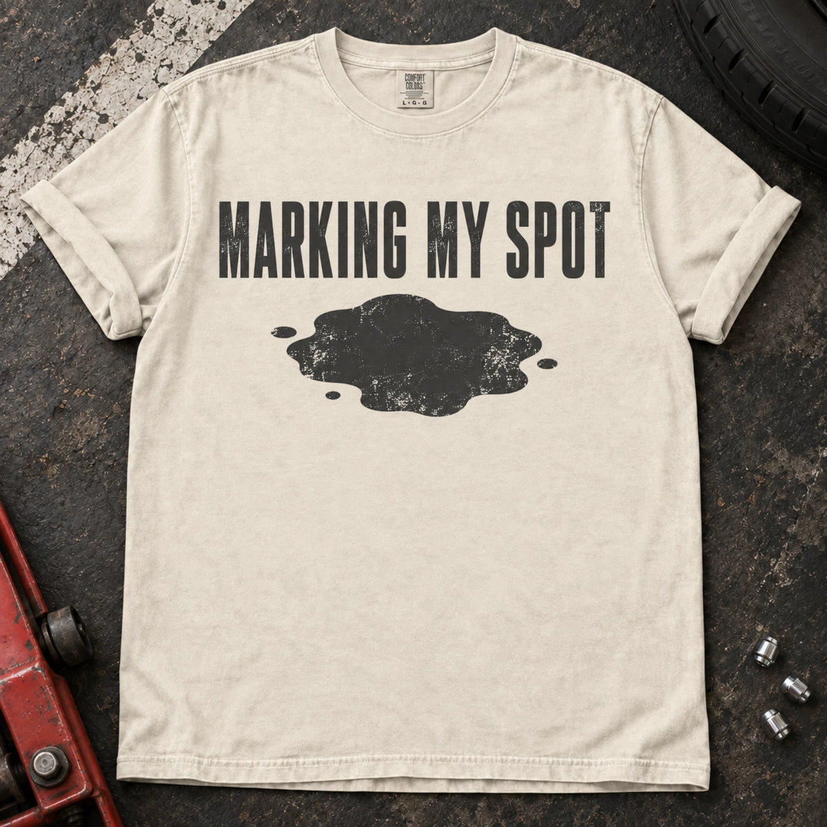 Ivory car enthusiast T-shirt. An oil puddle gives marking my spot a car-owner twist.
