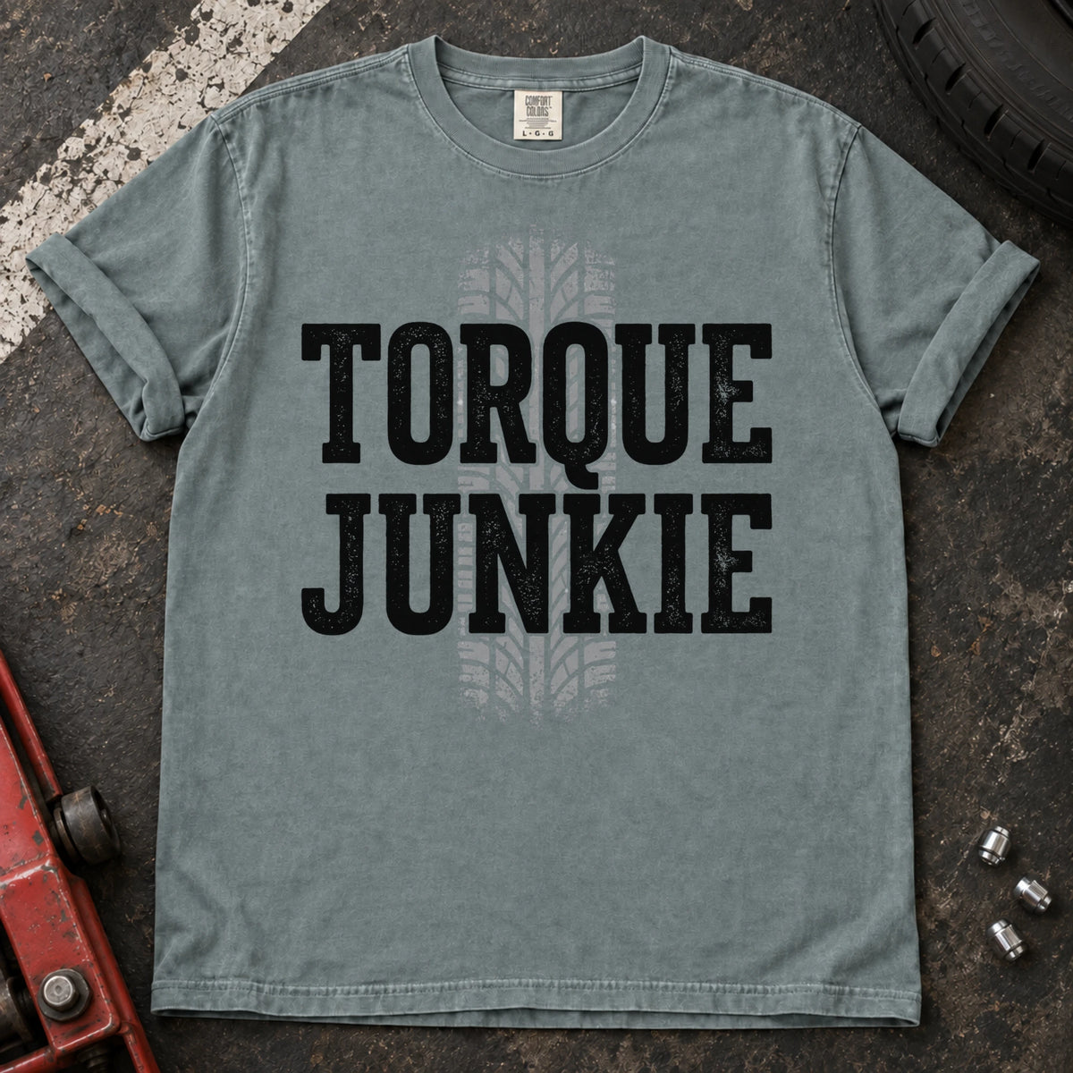 Bay car enthusiast T-shirt. A tire-tread stripe backs bold Torque Junkie lettering.
