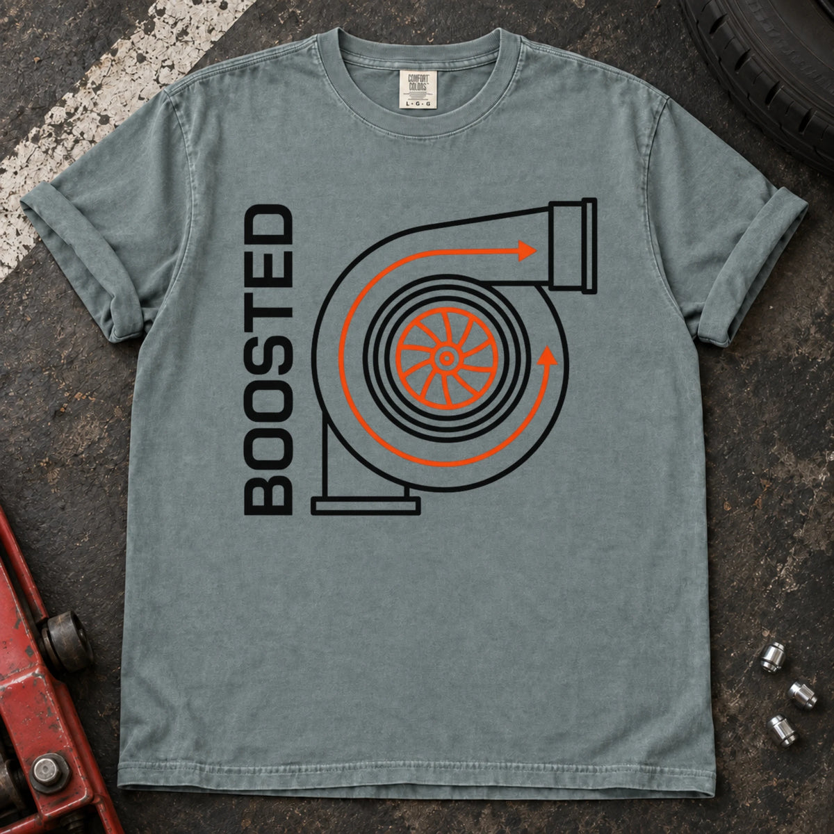 Bay car enthusiast T-shirt. A simplified turbo diagram gives Boosted an engine-enthusiast identity.
