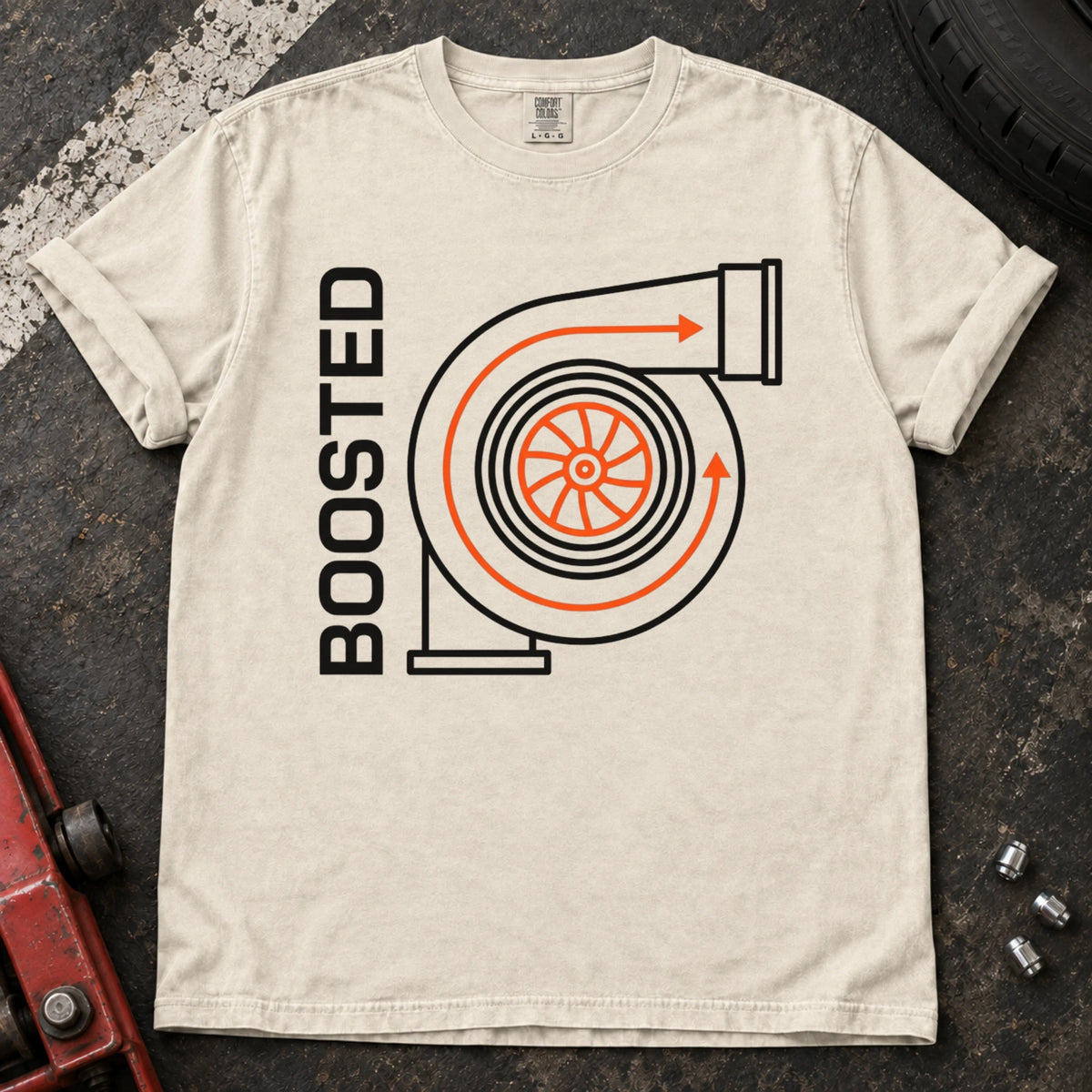 Ivory car enthusiast T-shirt. A simplified turbo diagram gives Boosted an engine-enthusiast identity.