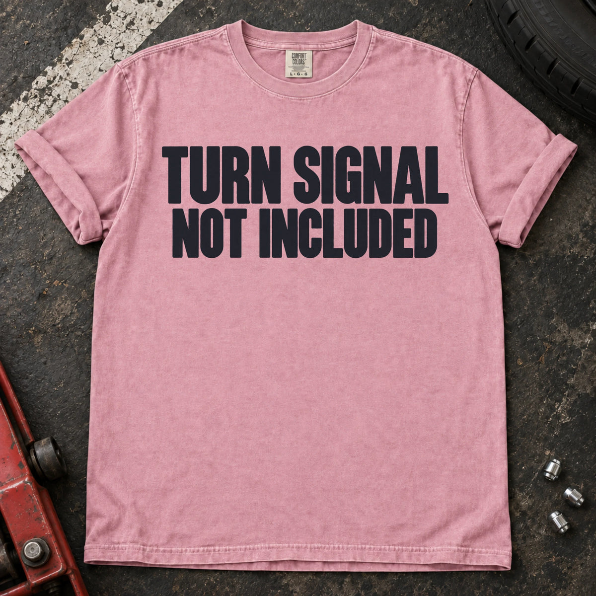 Blossom car enthusiast T-shirt. Turn signal not included: a deadpan automotive typography joke.
