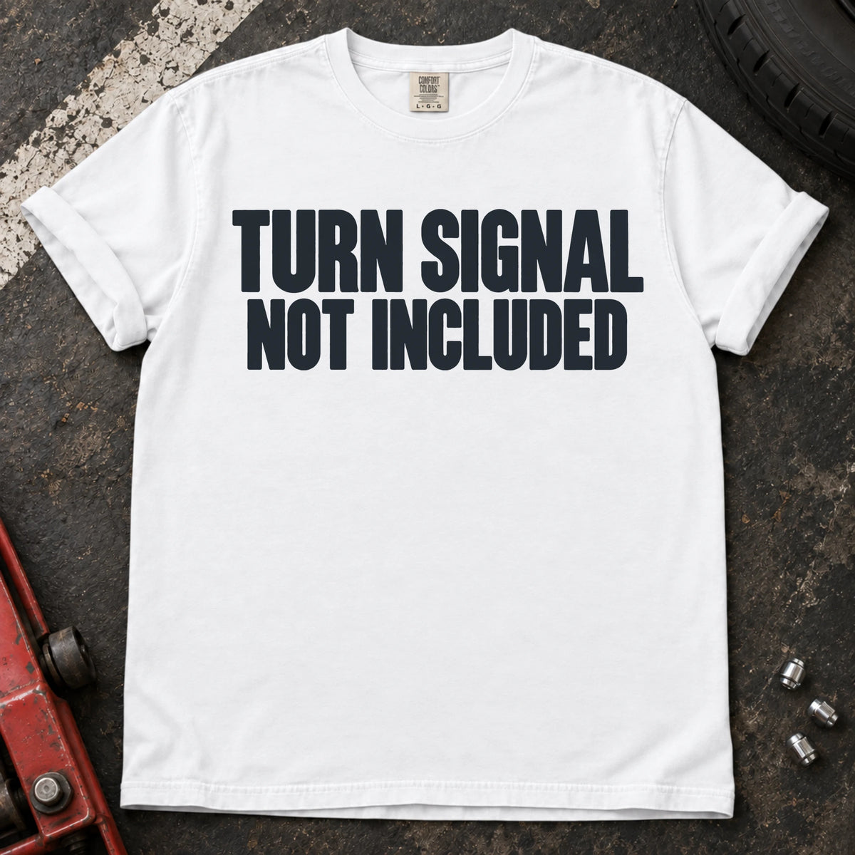 White car enthusiast T-shirt. Turn signal not included: a deadpan automotive typography joke.