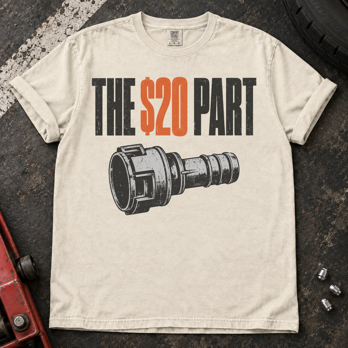 Ivory car enthusiast T-shirt. A small mechanical connector symbolizes the hoped-for twenty-dollar part.