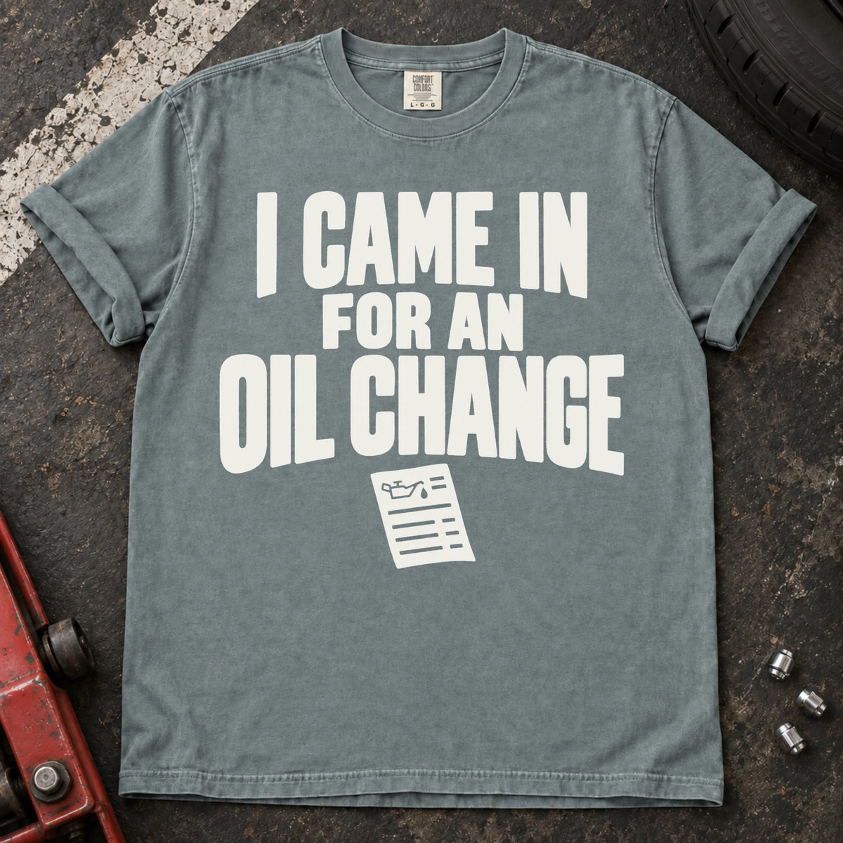 Bay T-shirt reading 'I came in for an oil change' above a small service invoice.