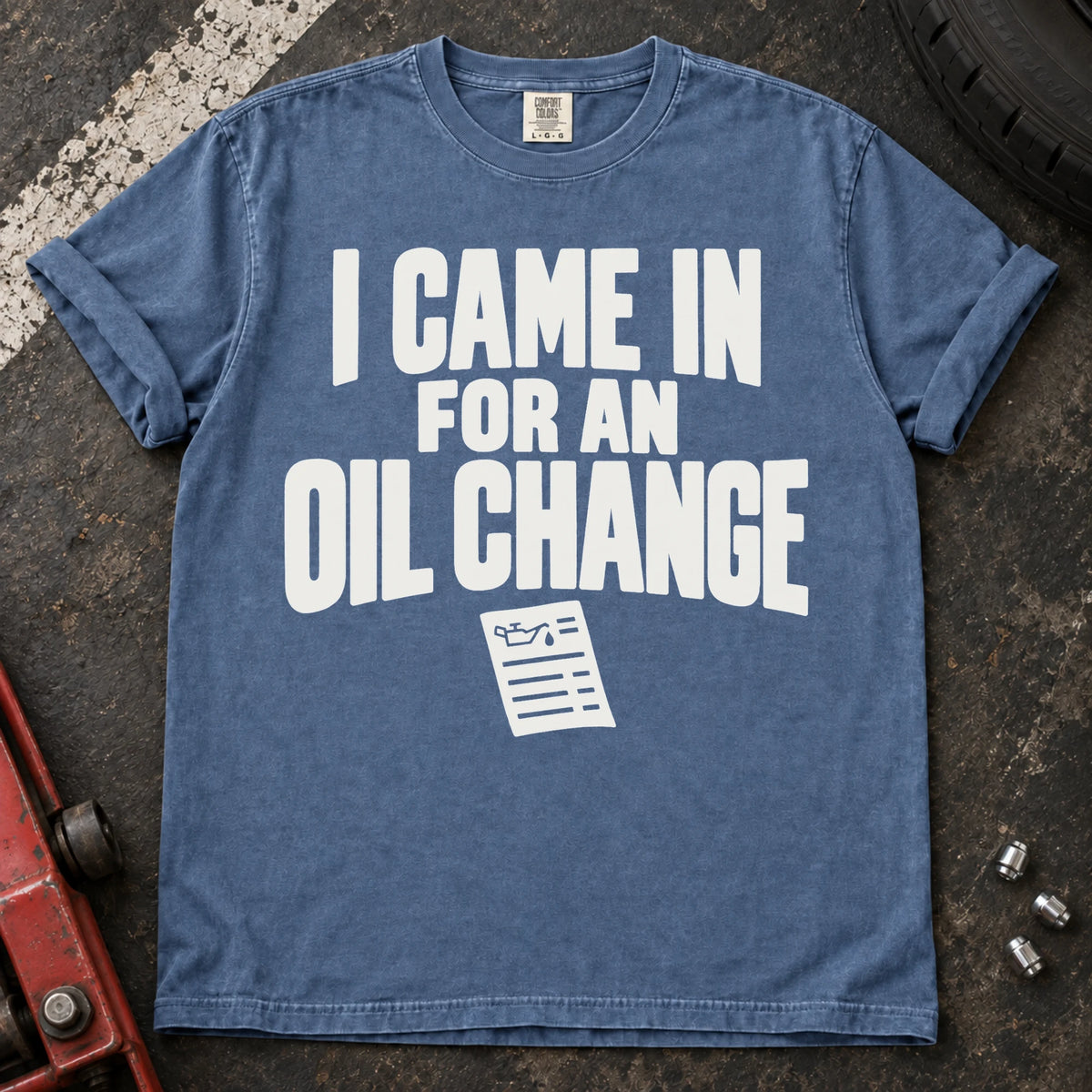 Blue Jean T-shirt reading 'I came in for an oil change' above a small service invoice.