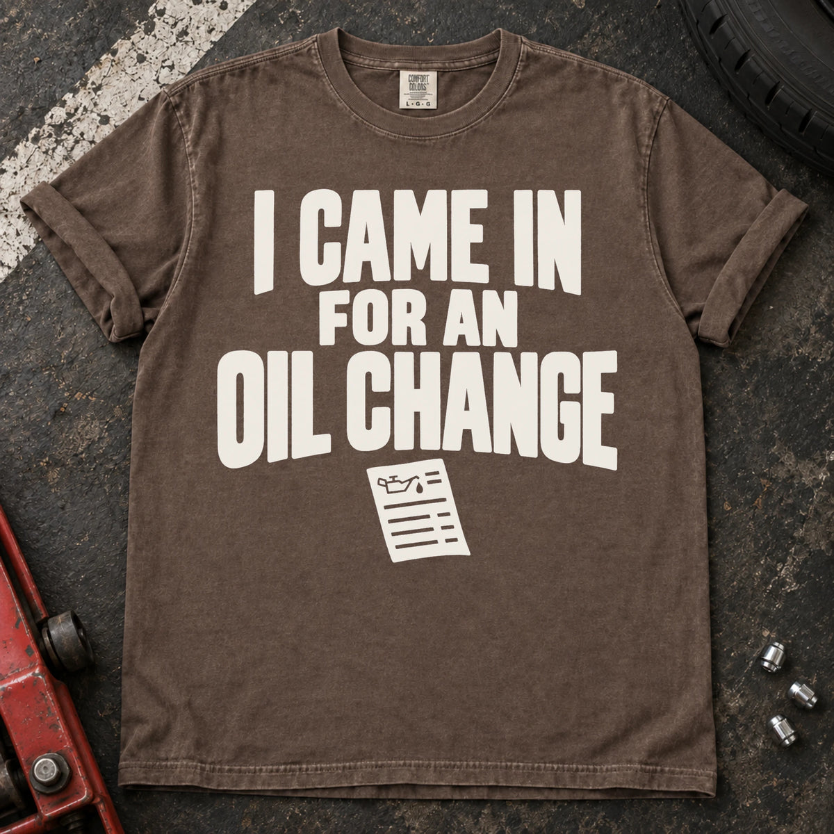 Espresso T-shirt reading 'I came in for an oil change' above a small service invoice.