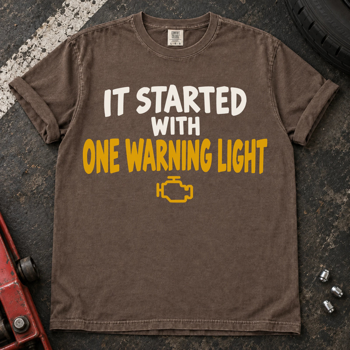 Espresso T-shirt reading 'It started with one warning light' above a check-engine symbol.