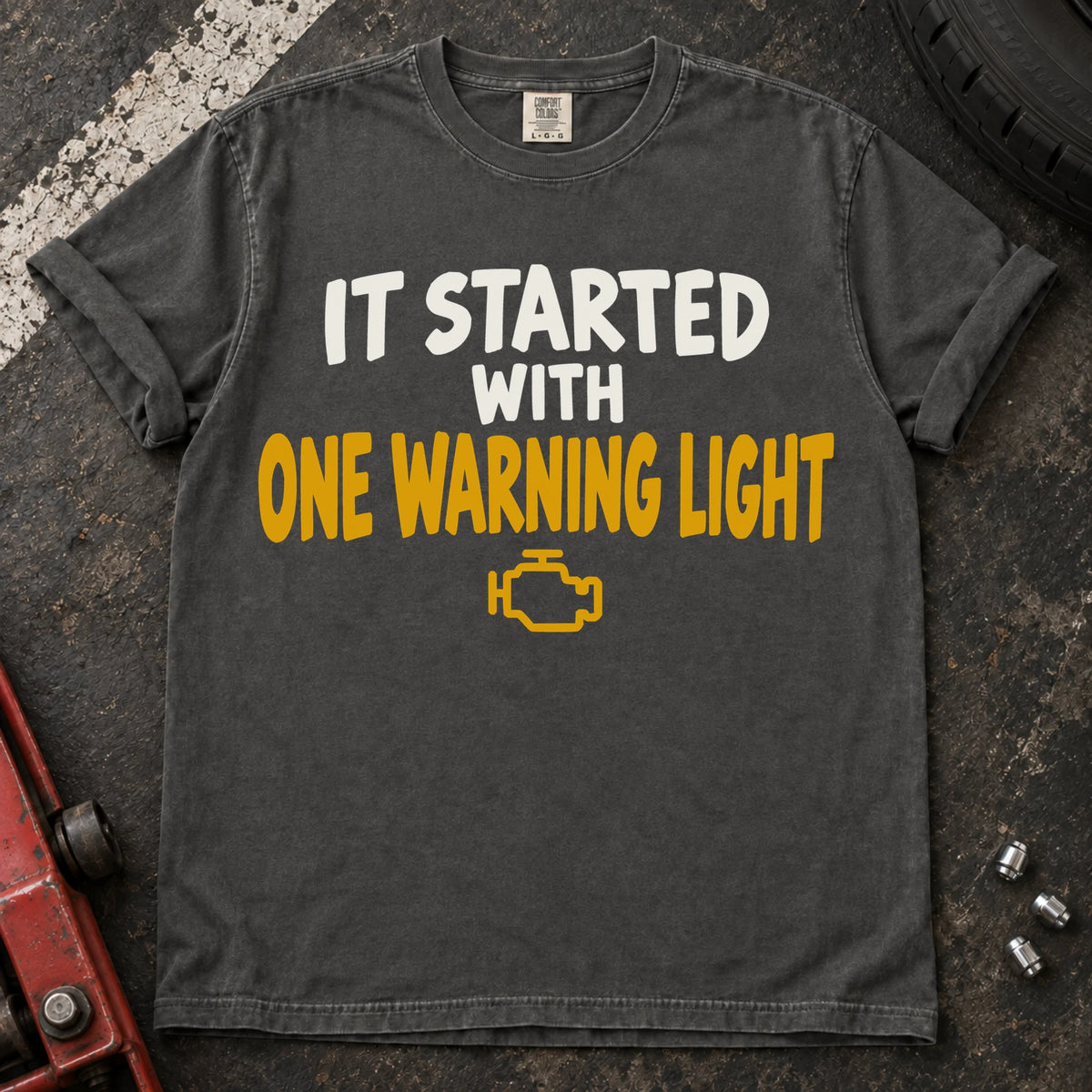 Pepper T-shirt reading 'It started with one warning light' above a check-engine symbol.