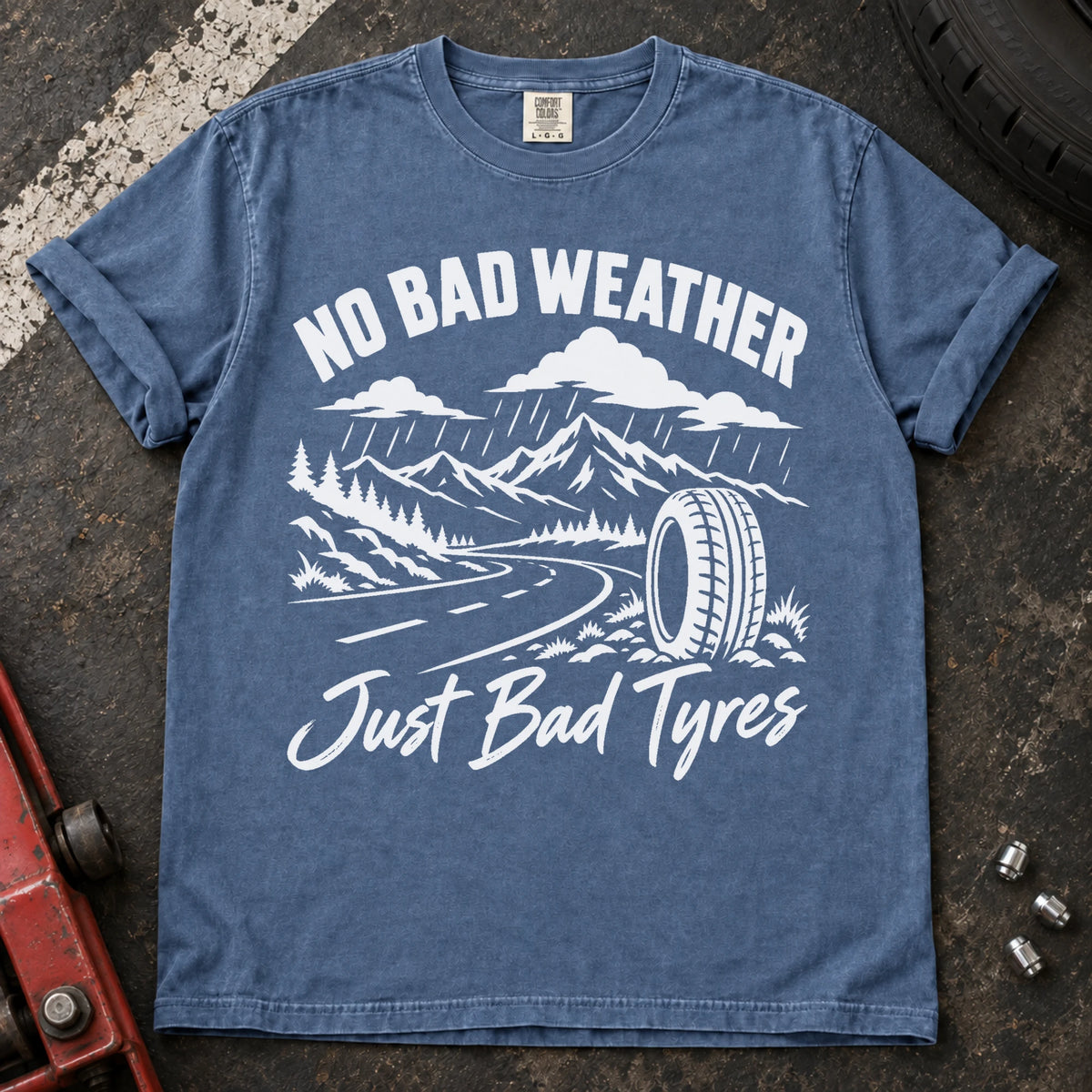 Blue Jean car enthusiast T-shirt. A rainy mountain road and tire explain no bad weather, just bad tyres.