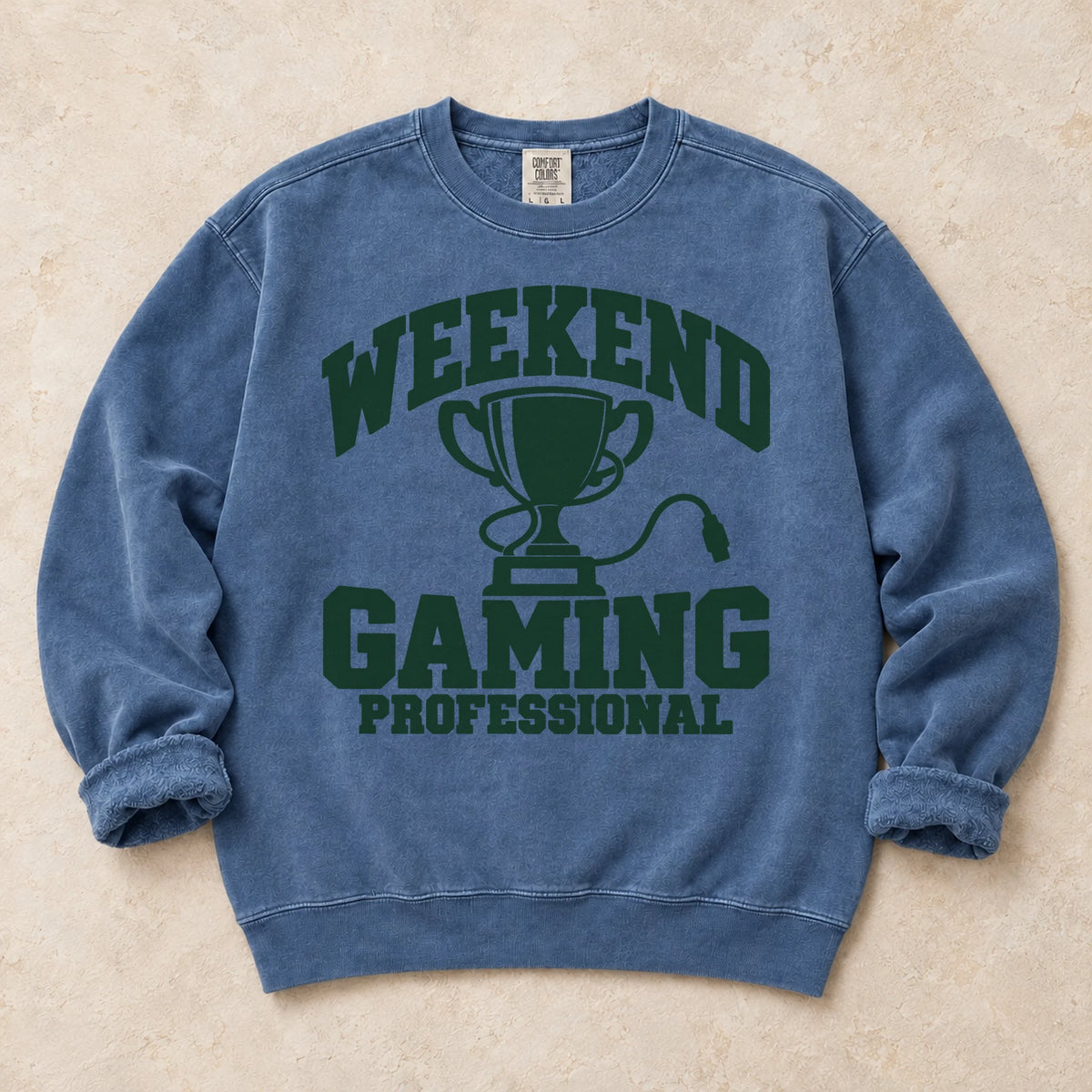 Blue Jean gaming sweatshirt. A trophy and gaming cable certify the weekend gaming professional.