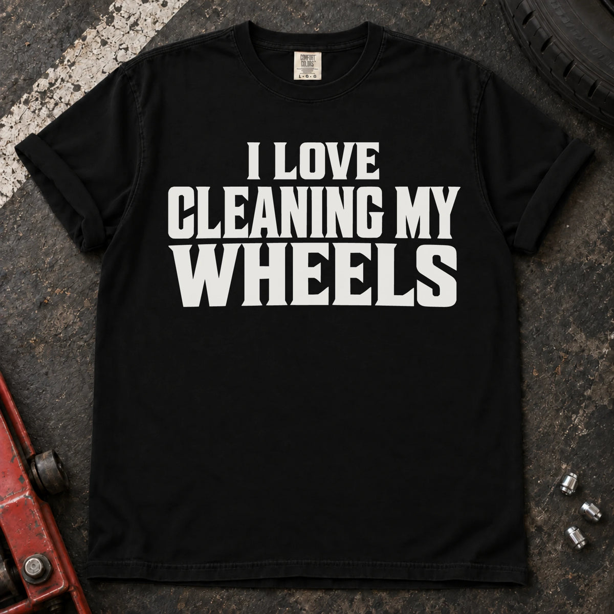 Black T-shirt with bold lettering reading 'I love cleaning my wheels'.