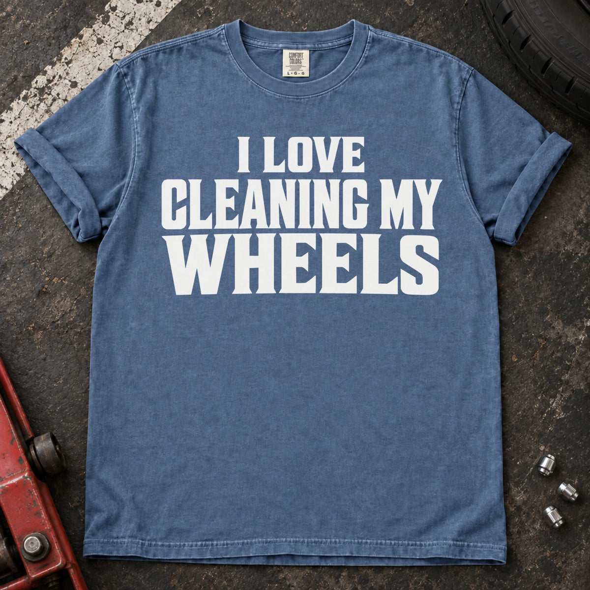 Blue Jean T-shirt with bold lettering reading 'I love cleaning my wheels'.