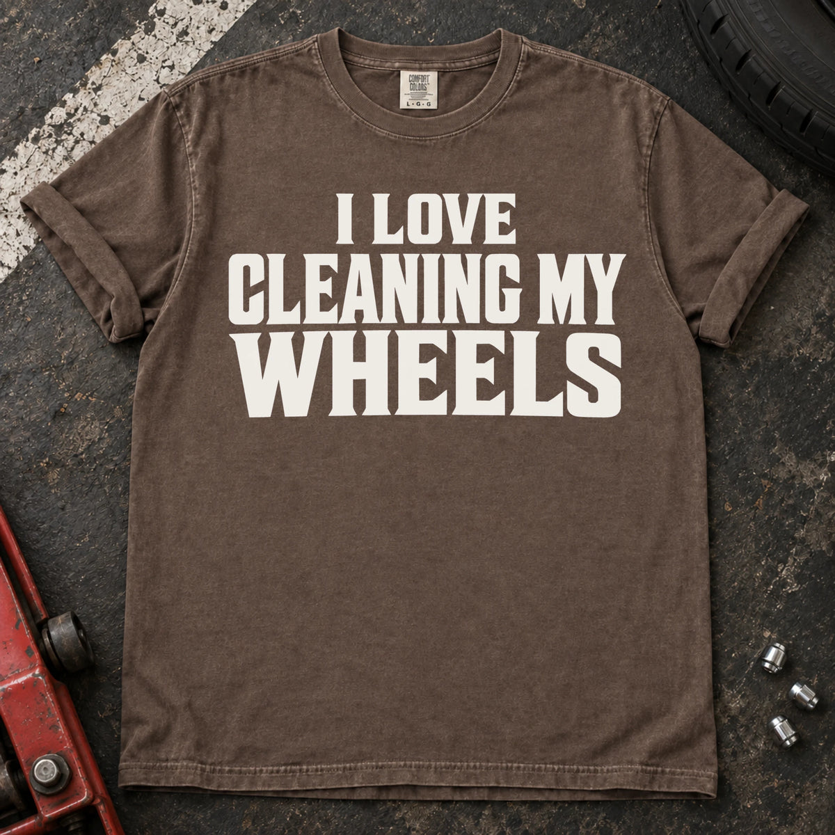 Espresso T-shirt with bold lettering reading 'I love cleaning my wheels'.